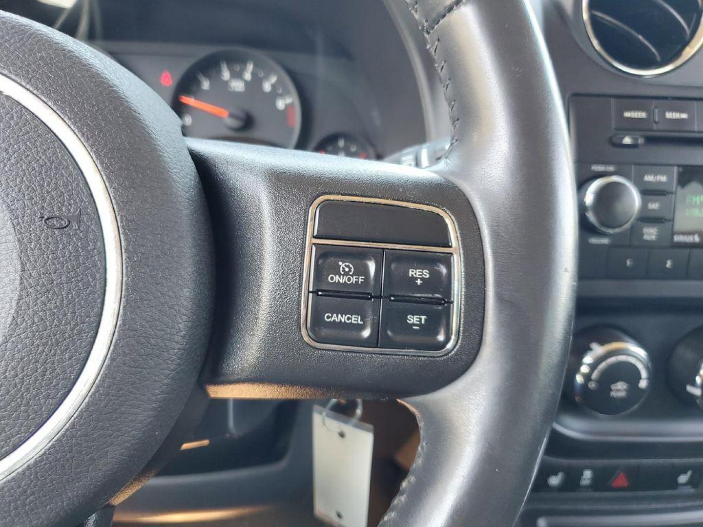 2013 Mineral Gray Metallic Clearcoat /Dark Slate Gray Jeep Patriot Latitude 4WD (1C4NJRFB5DD) with an 2.4L L4 DOHC 16V engine, CVT transmission, located at 234 Columbia Ave, Battle Creek, MI, 49015, (269) 222-0088, 42.298264, -85.192543 - When you encounter slick or muddy roads, you can engage the four wheel drive on this model and drive with confidence. Anti-lock brakes will help you stop in an emergency. The Jeep Patriot has a clean CARFAX vehicle history report. Maintaining a stable interior temperature in this vehicle is easy wit - Photo#15