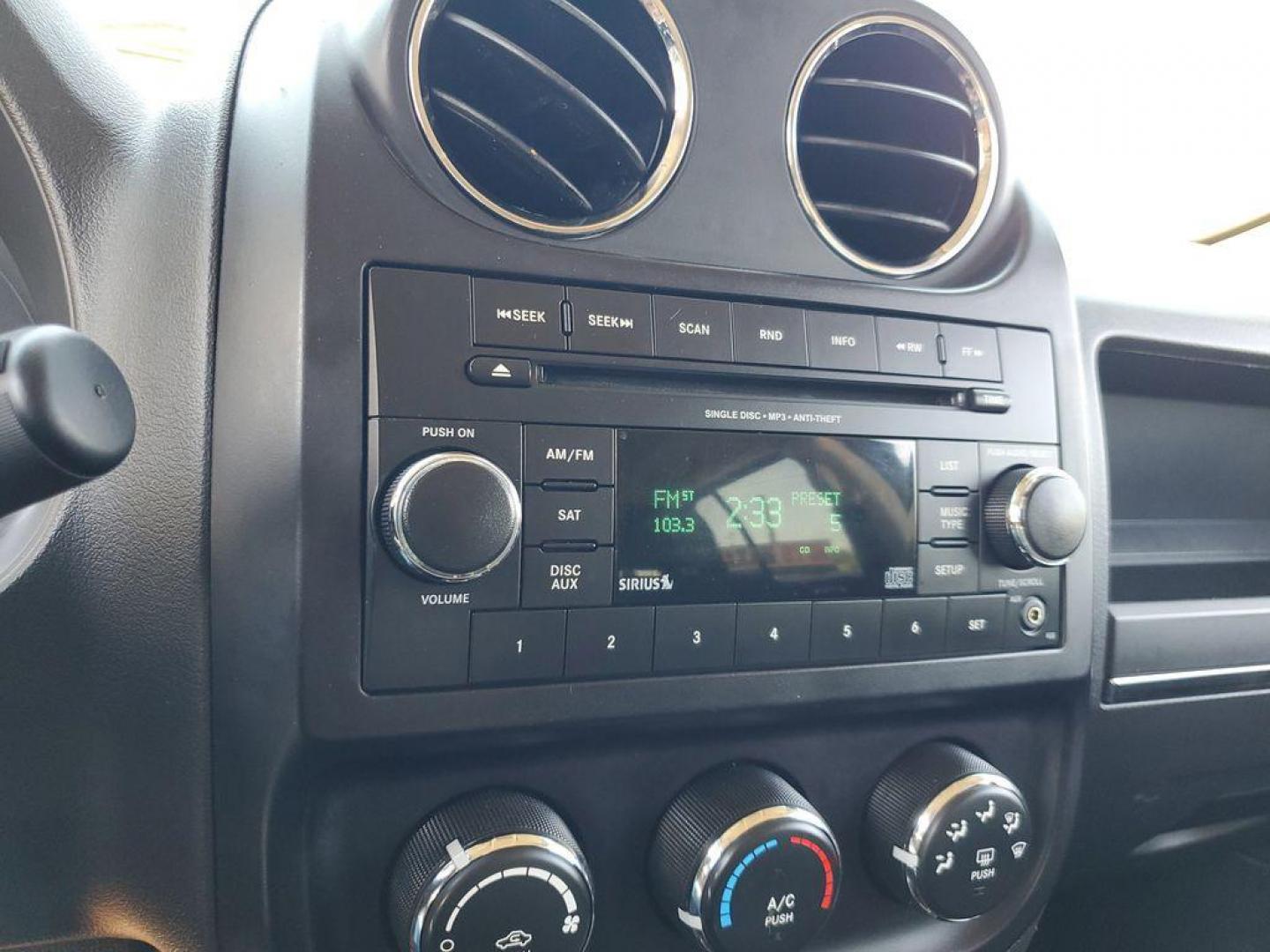 2013 Mineral Gray Metallic Clearcoat /Dark Slate Gray Jeep Patriot Latitude 4WD (1C4NJRFB5DD) with an 2.4L L4 DOHC 16V engine, CVT transmission, located at 234 Columbia Ave, Battle Creek, MI, 49015, (269) 222-0088, 42.298264, -85.192543 - When you encounter slick or muddy roads, you can engage the four wheel drive on this model and drive with confidence. Anti-lock brakes will help you stop in an emergency. The Jeep Patriot has a clean CARFAX vehicle history report. Maintaining a stable interior temperature in this vehicle is easy wit - Photo#16