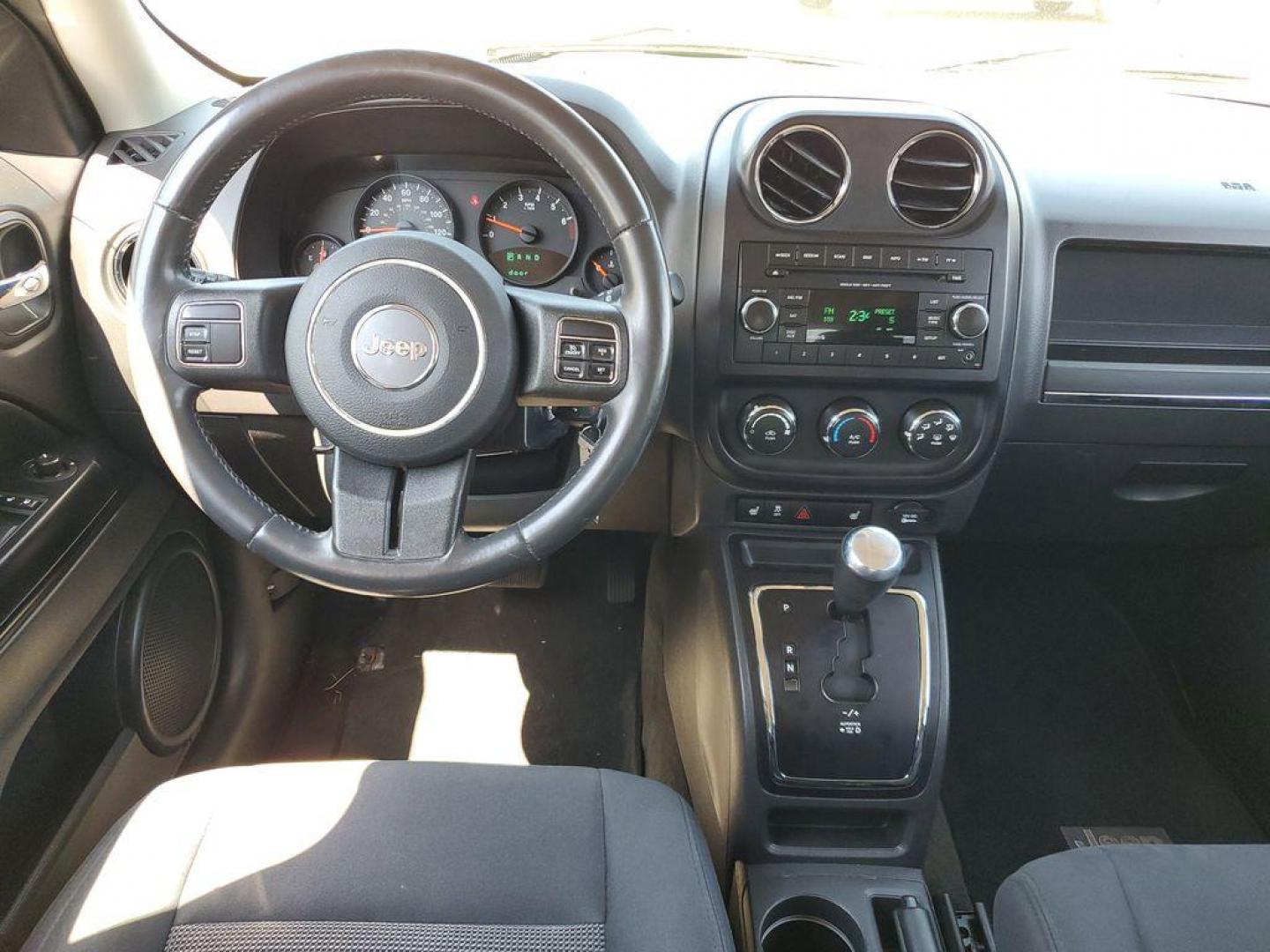 2013 Mineral Gray Metallic Clearcoat /Dark Slate Gray Jeep Patriot Latitude 4WD (1C4NJRFB5DD) with an 2.4L L4 DOHC 16V engine, CVT transmission, located at 234 Columbia Ave, Battle Creek, MI, 49015, (269) 222-0088, 42.298264, -85.192543 - When you encounter slick or muddy roads, you can engage the four wheel drive on this model and drive with confidence. Anti-lock brakes will help you stop in an emergency. The Jeep Patriot has a clean CARFAX vehicle history report. Maintaining a stable interior temperature in this vehicle is easy wit - Photo#21