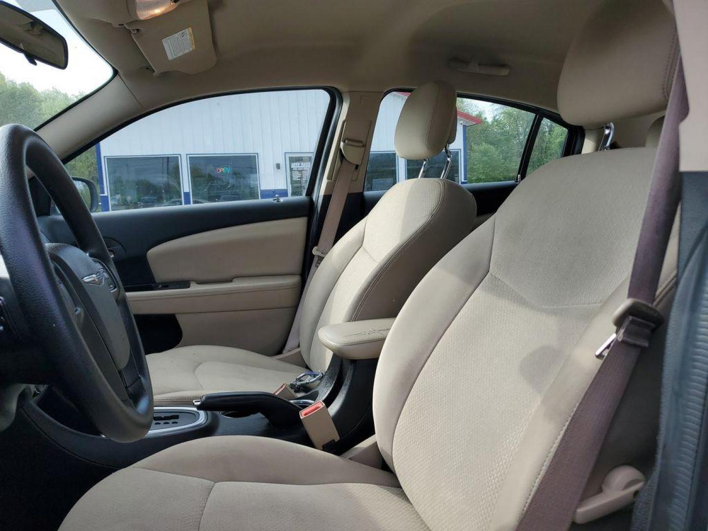 2014 Cashmere Pearlcoat /Light Frost Beige/Black Chrysler 200 LX (1C3CCBAB7EN) with an 2.4L L4 DOHC 16V engine, 6-Speed Automatic transmission, located at 6064 Gull Rd, Kalamazoo, MI, 49048, (269) 222-0088, 42.328388, -85.512924 - Discover the impressive 2014 Chrysler 200 LX, a perfect blend of style and efficiency, now available at an unbeatable price. This well-maintained sedan, featuring a CARFAX Clean Report, offers confidence and peace of mind with every drive. Equipped with front-wheel drive and a robust 4-cylinder, 2.4 - Photo#7