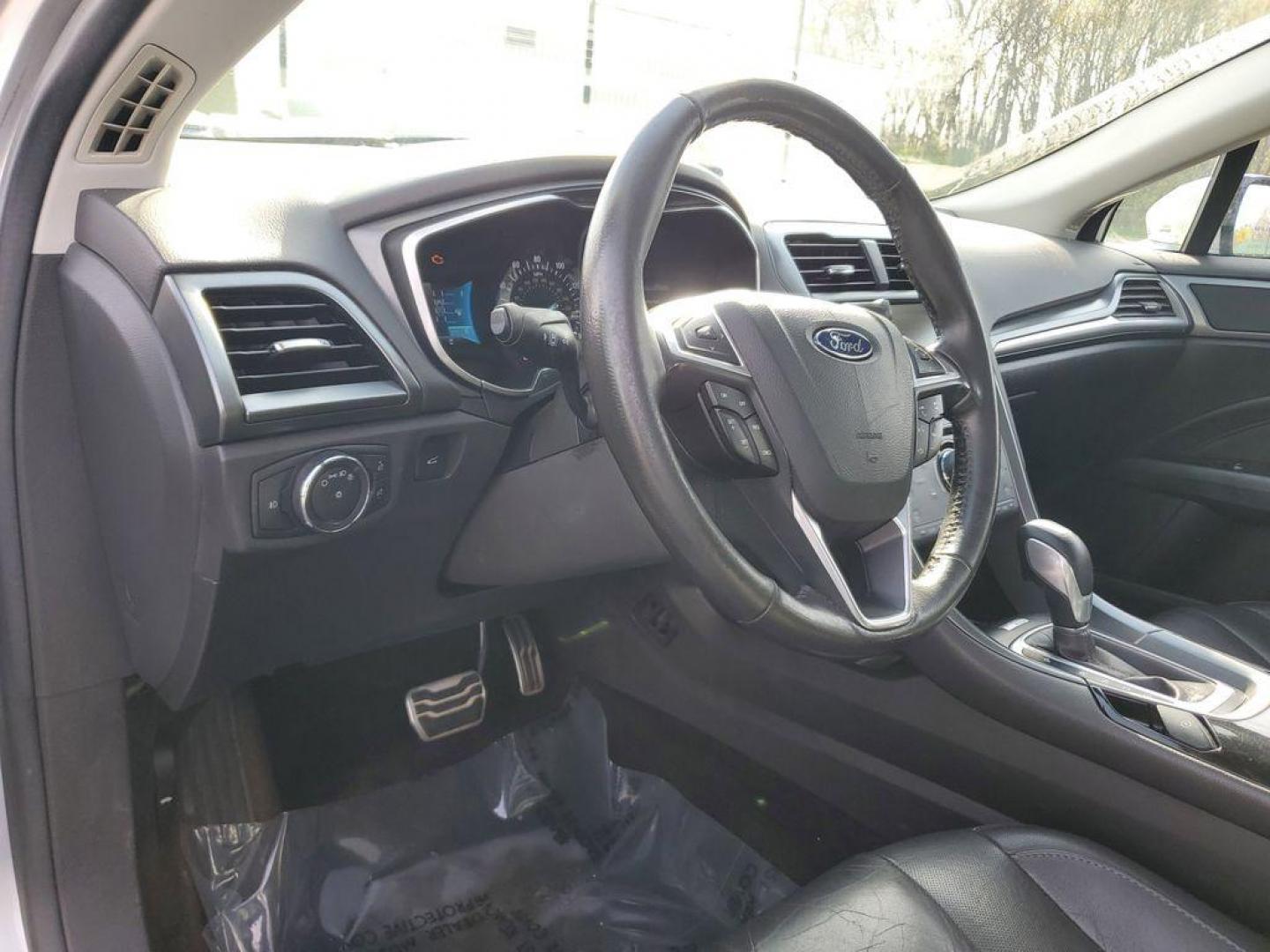 2014 Ingot Silver Metallic /Charcoal Black Ford Fusion Titanium AWD (3FA6P0D93ER) with an 2.0L L4 DOHC 16V engine, 6-speed automatic transmission, located at 6064 Gull Rd, Kalamazoo, MI, 49048, (269) 222-0088, 42.328388, -85.512924 - Discover the perfect blend of style, performance, and comfort with our 2014 Ford Fusion Titanium. This exceptional vehicle is equipped with all-wheel drive, ensuring confident handling and superior traction in all weather conditions. Under the hood, you'll find a robust 4-cylinder, 2.0L engine that - Photo#15