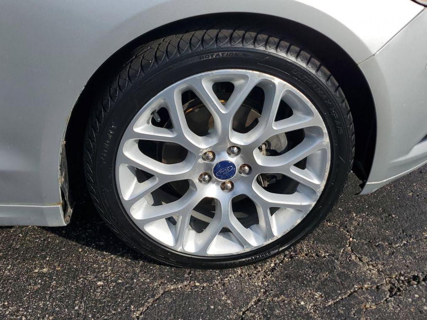 2014 Ingot Silver Metallic /Charcoal Black Ford Fusion Titanium AWD (3FA6P0D93ER) with an 2.0L L4 DOHC 16V engine, 6-speed automatic transmission, located at 6064 Gull Rd, Kalamazoo, MI, 49048, (269) 222-0088, 42.328388, -85.512924 - Discover the perfect blend of style, performance, and comfort with our 2014 Ford Fusion Titanium. This exceptional vehicle is equipped with all-wheel drive, ensuring confident handling and superior traction in all weather conditions. Under the hood, you'll find a robust 4-cylinder, 2.0L engine that - Photo#4
