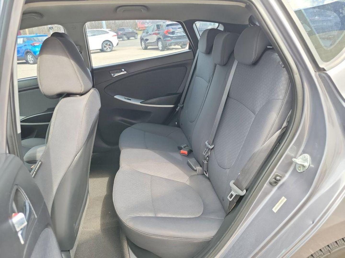 2014 Triathlon Gray Metallic /Black Hyundai Accent SE 5-Door (KMHCU5AE5EU) with an 1.6L L4 DOHC 16V engine, 6-speed automatic transmission, located at 234 Columbia Ave, Battle Creek, MI, 49015, (269) 222-0088, 42.298264, -85.192543 - <b>Vehicle Details</b><br>Discover a fantastic opportunity to own a reliable and efficient 2014 Hyundai Accent SE. Perfect for daily commutes or weekend getaways, this compact sedan offers excellent fuel economy with its 4-cylinder, 1.6L engine. Its a smart choice for those seeking affordability and - Photo#8