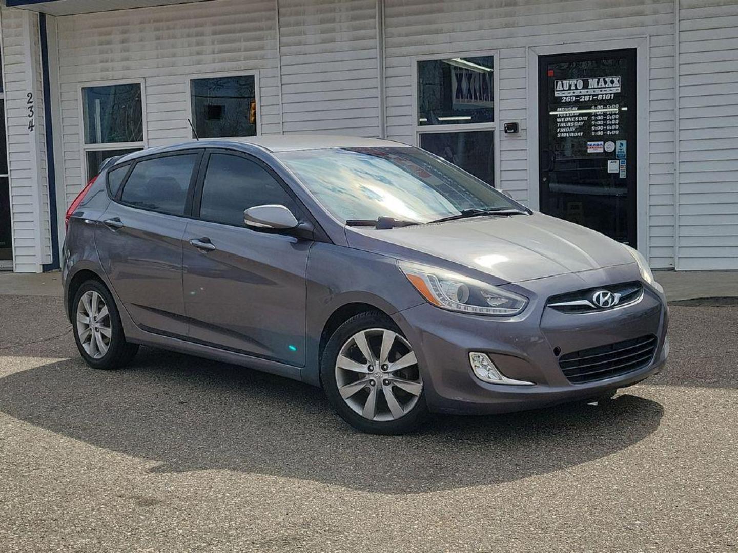 2014 Triathlon Gray Metallic /Black Hyundai Accent SE 5-Door (KMHCU5AE5EU) with an 1.6L L4 DOHC 16V engine, 6-speed automatic transmission, located at 234 Columbia Ave, Battle Creek, MI, 49015, (269) 222-0088, 42.298264, -85.192543 - <b>Vehicle Details</b><br>Discover a fantastic opportunity to own a reliable and efficient 2014 Hyundai Accent SE. Perfect for daily commutes or weekend getaways, this compact sedan offers excellent fuel economy with its 4-cylinder, 1.6L engine. Its a smart choice for those seeking affordability and - Photo#0