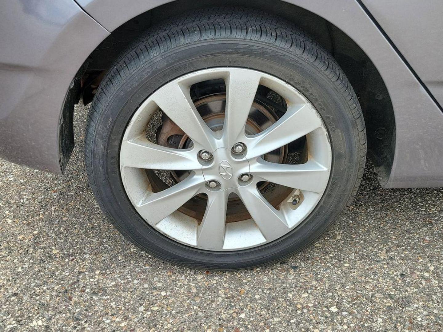 2014 Triathlon Gray Metallic /Black Hyundai Accent SE 5-Door (KMHCU5AE5EU) with an 1.6L L4 DOHC 16V engine, 6-speed automatic transmission, located at 234 Columbia Ave, Battle Creek, MI, 49015, (269) 222-0088, 42.298264, -85.192543 - <b>Vehicle Details</b><br>Discover a fantastic opportunity to own a reliable and efficient 2014 Hyundai Accent SE. Perfect for daily commutes or weekend getaways, this compact sedan offers excellent fuel economy with its 4-cylinder, 1.6L engine. Its a smart choice for those seeking affordability and - Photo#4