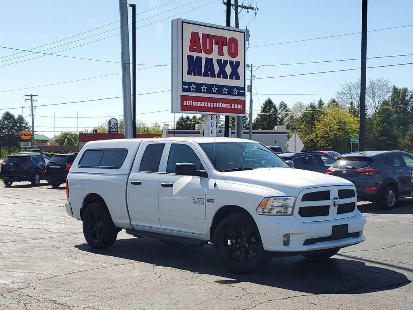 2016 Bright White Clearcoat /Diesel Gray/Black RAM 1500 Tradesman Quad Cab 4WD (1C6RR7FT0GS) with an 5.7L V8 OHV 16V engine, 6A transmission, located at 6064 Gull Rd, Kalamazoo, MI, 49048, (269) 222-0088, 42.328388, -85.512924 - Experience the power and versatility of the 2016 Ram 1500, a robust pickup designed to tackle any challenge. Equipped with a formidable V8, 5.7L engine and 4WD, this truck delivers exceptional performance both on and off the road. With its clean CARFAX report, you can have peace of mind knowing that - Photo#0