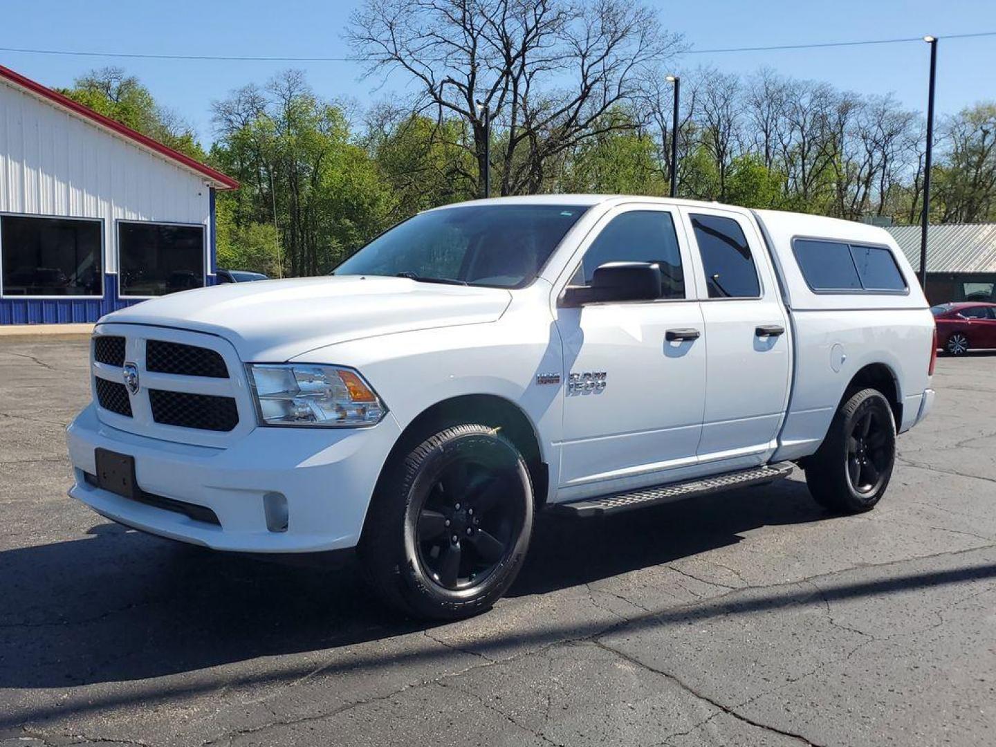 2016 Bright White Clearcoat /Diesel Gray/Black RAM 1500 Tradesman Quad Cab 4WD (1C6RR7FT0GS) with an 5.7L V8 OHV 16V engine, 6A transmission, located at 6064 Gull Rd, Kalamazoo, MI, 49048, (269) 222-0088, 42.328388, -85.512924 - Experience the power and versatility of the 2016 Ram 1500, a robust pickup designed to tackle any challenge. Equipped with a formidable V8, 5.7L engine and 4WD, this truck delivers exceptional performance both on and off the road. With its clean CARFAX report, you can have peace of mind knowing that - Photo#1