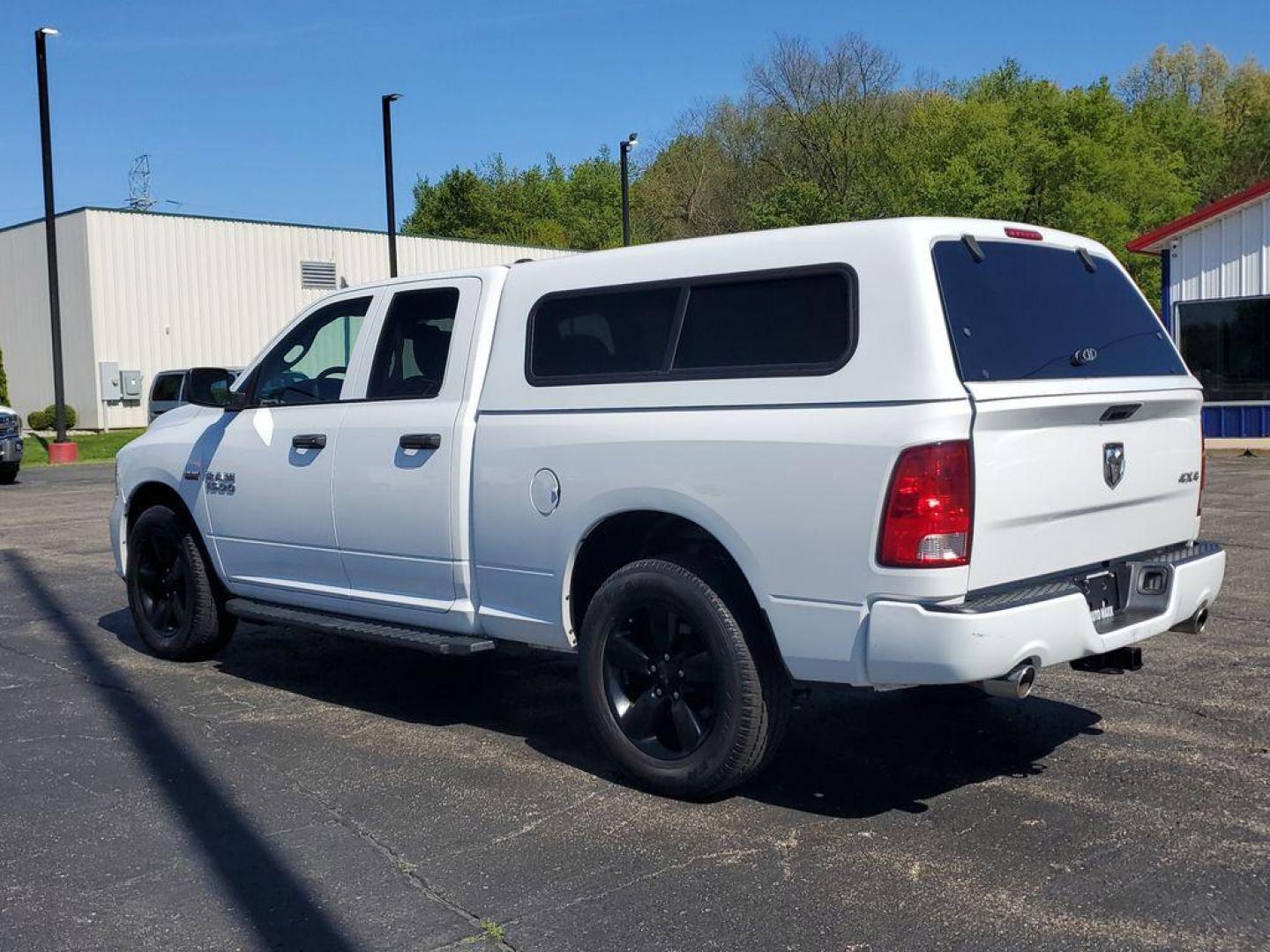 2016 Bright White Clearcoat /Diesel Gray/Black RAM 1500 Tradesman Quad Cab 4WD (1C6RR7FT0GS) with an 5.7L V8 OHV 16V engine, 6A transmission, located at 6064 Gull Rd, Kalamazoo, MI, 49048, (269) 222-0088, 42.328388, -85.512924 - Experience the power and versatility of the 2016 Ram 1500, a robust pickup designed to tackle any challenge. Equipped with a formidable V8, 5.7L engine and 4WD, this truck delivers exceptional performance both on and off the road. With its clean CARFAX report, you can have peace of mind knowing that - Photo#2