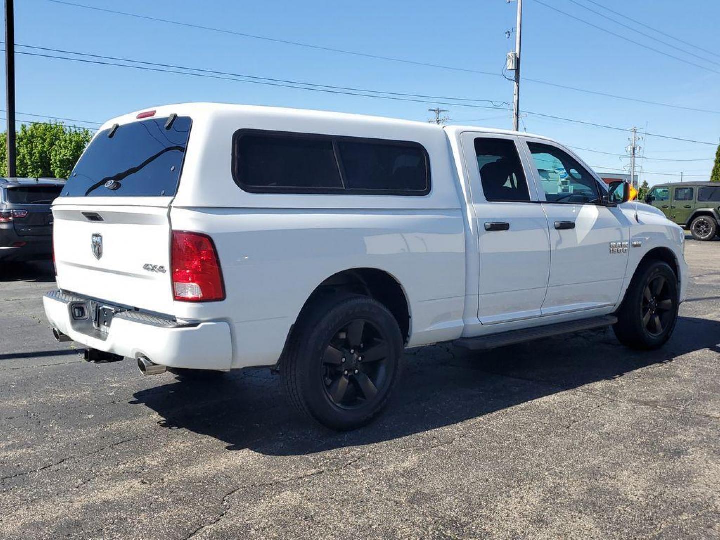 2016 Bright White Clearcoat /Diesel Gray/Black RAM 1500 Tradesman Quad Cab 4WD (1C6RR7FT0GS) with an 5.7L V8 OHV 16V engine, 6A transmission, located at 6064 Gull Rd, Kalamazoo, MI, 49048, (269) 222-0088, 42.328388, -85.512924 - Experience the power and versatility of the 2016 Ram 1500, a robust pickup designed to tackle any challenge. Equipped with a formidable V8, 5.7L engine and 4WD, this truck delivers exceptional performance both on and off the road. With its clean CARFAX report, you can have peace of mind knowing that - Photo#3
