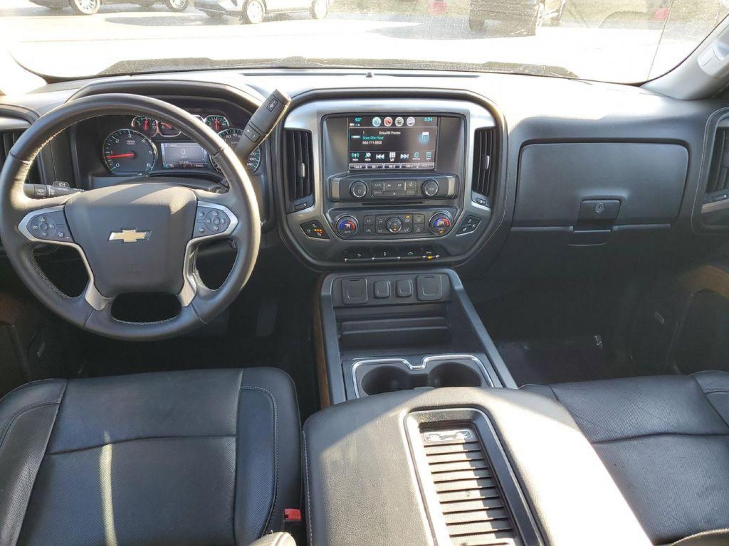2017 Black /Jet Black Chevrolet Silverado 1500 LTZ Crew Cab Long Box 4WD (3GCUKSEC6HG) with an 5.3L V8 OHV 16V engine, 6A transmission, located at 6064 Gull Rd, Kalamazoo, MI, 49048, (269) 222-0088, 42.328388, -85.512924 - For those seeking a blend of power and luxury, look no further than this exceptional 2017 Chevrolet Silverado 1500 LTZ. This robust pickup combines a commanding V8, 5.3L engine with 4WD capabilities, ensuring you conquer any terrain with confidence. Whether you're navigating city streets or rugged t - Photo#5