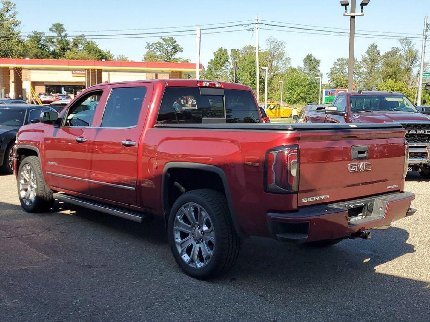 2018 Red Quartz Tintcoat /Jet Black GMC Sierra 1500 Denali Crew Cab Long Box 4WD (3GTU2PEJ9JG) with an 6.2L V8 OHV 16V engine, 6A transmission, located at 6064 Gull Rd, Kalamazoo, MI, 49048, (269) 222-0088, 42.328388, -85.512924 - <b>Vehicle Details</b><br>Discover the power and luxury of the 2018 GMC Sierra 1500 Denali at our dealership. This pre-owned gem comes equipped with a robust V8, 6.2L engine and 4WD, ensuring you have the muscle and traction needed for any adventure or tough job. Step inside to experience true com - Photo#2