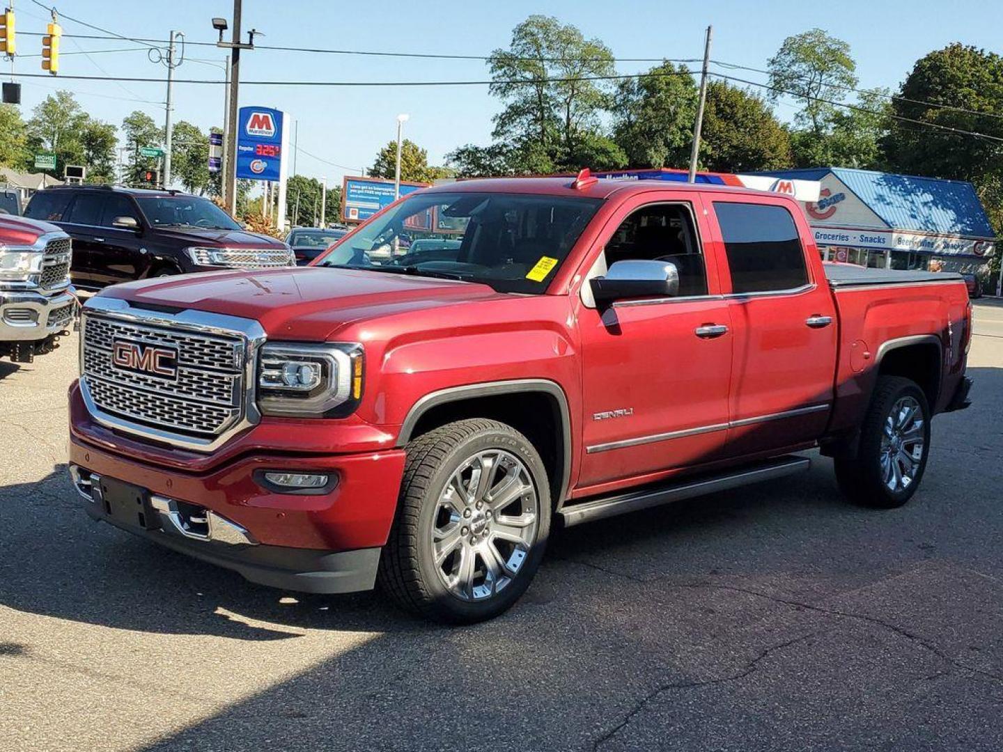 2018 Red Quartz Tintcoat /Jet Black GMC Sierra 1500 Denali Crew Cab Long Box 4WD (3GTU2PEJ9JG) with an 6.2L V8 OHV 16V engine, 6A transmission, located at 6064 Gull Rd, Kalamazoo, MI, 49048, (269) 222-0088, 42.328388, -85.512924 - <b>Vehicle Details</b><br>Discover the power and luxury of the 2018 GMC Sierra 1500 Denali at our dealership. This pre-owned gem comes equipped with a robust V8, 6.2L engine and 4WD, ensuring you have the muscle and traction needed for any adventure or tough job. Step inside to experience true com - Photo#3
