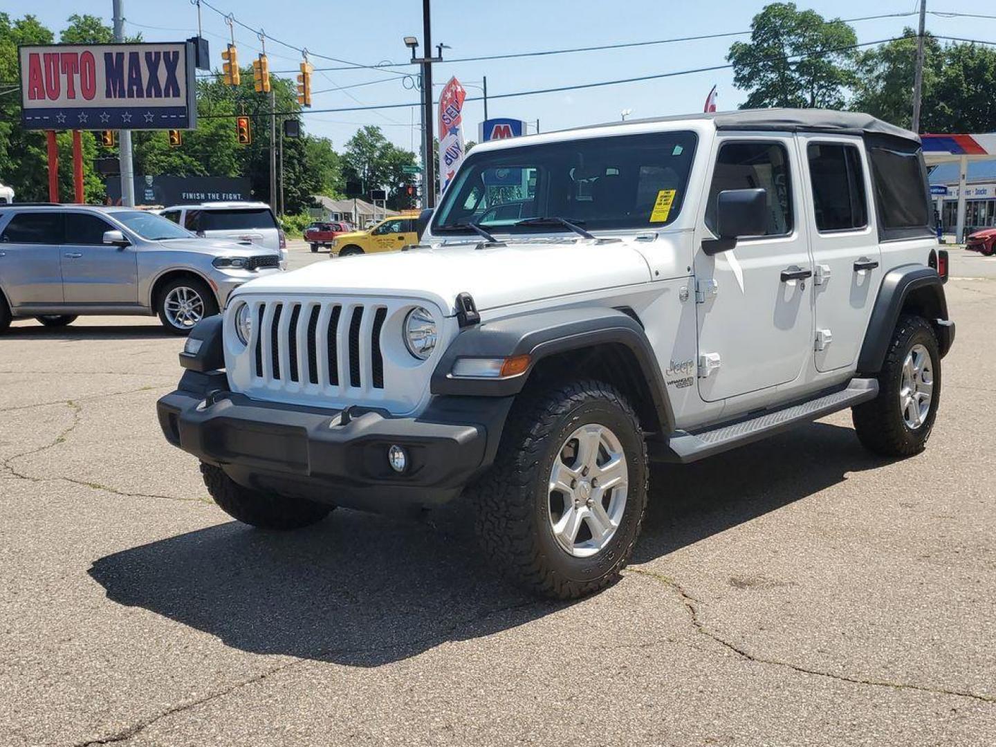 2018 Bright White Clearcoat /Black Jeep Wrangler JK Unlimited Sport (1C4HJXDG9JW) with an 3.6L V6 DOHC 24V FFV engine, 6A transmission, located at 234 Columbia Ave, Battle Creek, MI, 49015, (269) 222-0088, 42.298264, -85.192543 - <b>Vehicle Details</b><br>Unleash your adventurous spirit with this stunning 2018 Jeep Wrangler Sport S! Engineered for excitement and built to conquer any terrain, this dynamic 4WD powerhouse is equipped with a robust V6, 3.6L engine that delivers exceptional performance and reliability. Whether yo - Photo#1