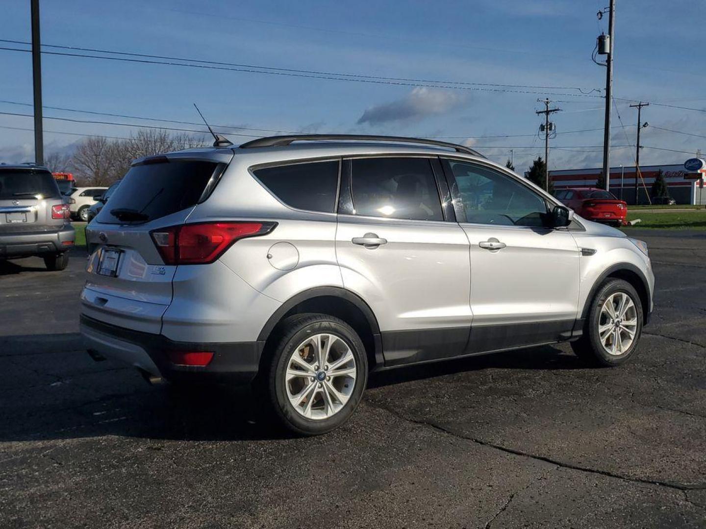2019 Ingot Silver Metallic /Charcoal Black Ford Escape SEL 4WD (1FMCU9HD7KU) with an 1.5L L4 DOHC 16V engine, 6A transmission, located at 6064 Gull Rd, Kalamazoo, MI, 49048, (269) 222-0088, 42.328388, -85.512924 - Discover exceptional versatility with our 2019 Ford Escape SEL, designed to elevate your driving experience. This stylish SUV, equipped with 4WD and a responsive 4-cylinder, 1.5L engine, offers a perfect blend of power and efficiency for any adventure.<br><br>Step inside to find a spacious, well-app - Photo#3
