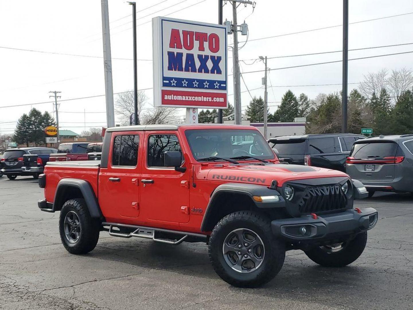 2020 Red /Black Jeep Gladiator Rubicon (1C6JJTBG9LL) with an 3.6L V6 DOHC 24V engine, 6M transmission, located at 6064 Gull Rd, Kalamazoo, MI, 49048, (269) 222-0088, 42.328388, -85.512924 - Discover rugged capability and modern luxury with this 2020 Jeep Gladiator Rubicon, designed to take you places others only dream of. Equipped with a powerful V6, 3.6L engine and 4WD, this Jeep Gladiator is the ultimate off-road companion, ready to tackle any terrain with confidence.<br><br>This str - Photo#0