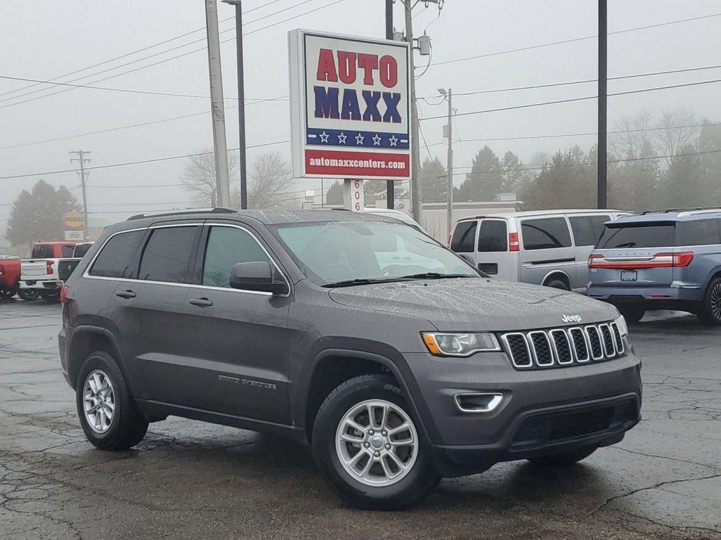 2020 Granite Crystal Metallic Clearcoat /BLACK Jeep Grand Cherokee Laredo 4WD (1C4RJFAG7LC) with an 3.6L V6 DOHC 24V engine, 8A transmission, located at 6064 Gull Rd, Kalamazoo, MI, 49048, (269) 222-0088, 42.328388, -85.512924 - Discover the perfect blend of power and sophistication with this pre-owned 2020 Jeep Grand Cherokee Laredo E, equipped with 4WD for those who crave adventure and reliability. Under the hood lies a robust V6, 3.6L engine that effortlessly balances performance with fuel efficiency, ensuring every jour - Photo#0