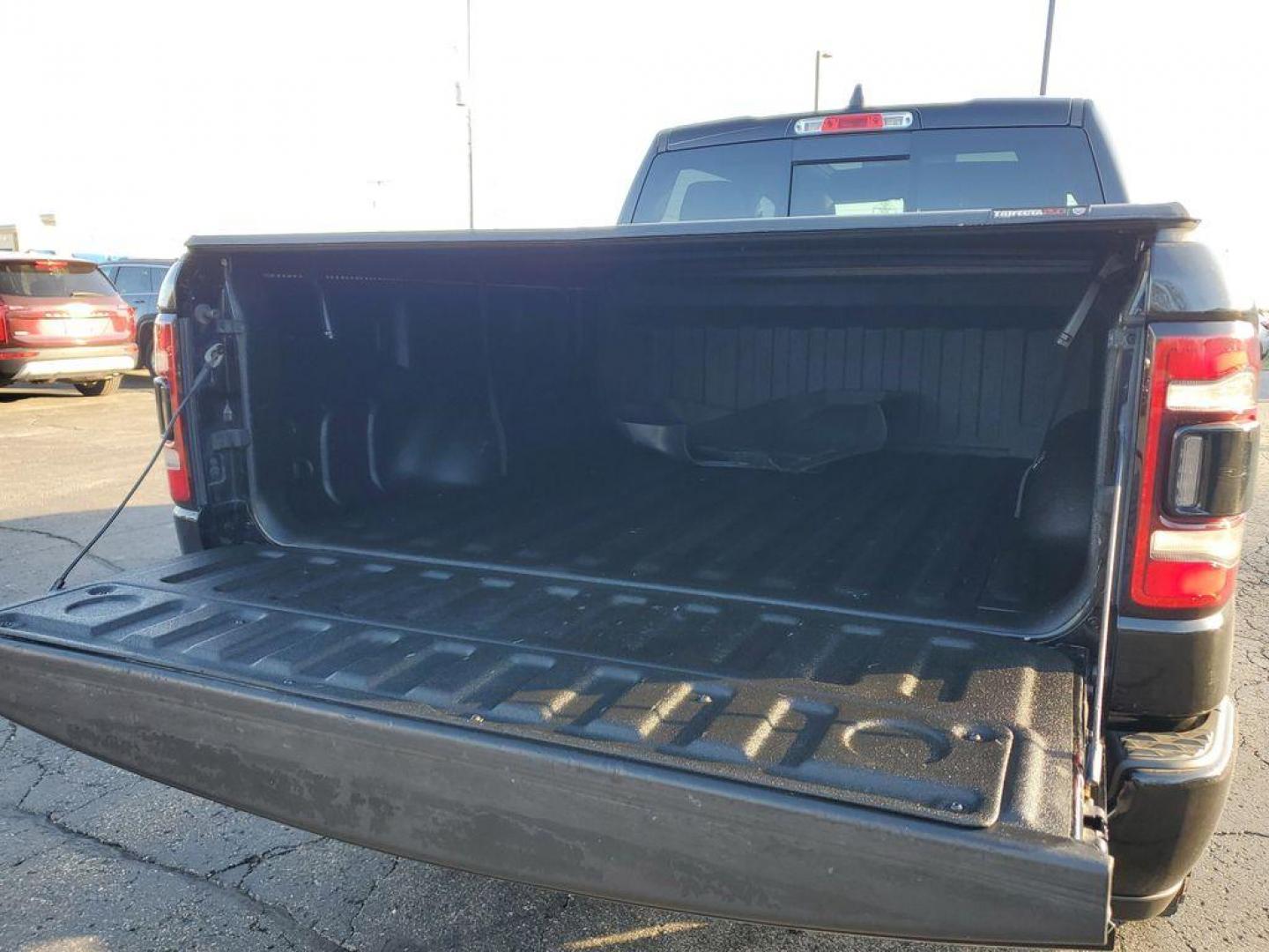 2020 Diamond Black Crystal Pearl /Black RAM 1500 Rebel Crew Cab SB 4WD (1C6SRFLT2LN) with an 5.7L V8 OHV 16V engine, 8A transmission, located at 6064 Gull Rd, Kalamazoo, MI, 49048, (269) 222-0088, 42.328388, -85.512924 - <b>Vehicle Details</b><br>Unleash the power and sophistication of the 2020 Ram 1500 Sport, an exceptional truck that promises to elevate your driving experience to new heights. With zero miles on the odometer, this rugged beast is practically untouched, ready to conquer any terrain you throw its way - Photo#6