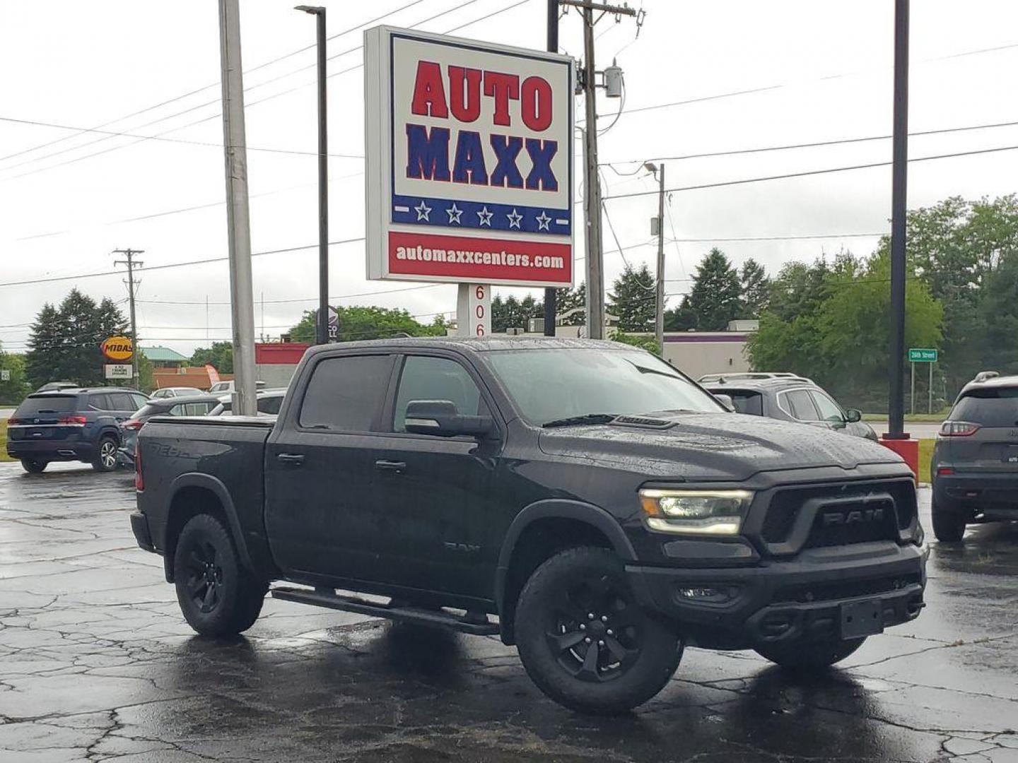 2020 Diamond Black Crystal Pearl /BLACK RAM 1500 Rebel Crew Cab SB 4WD (1C6SRFLT0LN) with an 5.7L V8 OHV 16V engine, 8A transmission, located at 6064 Gull Rd, Kalamazoo, MI, 49048, (269) 222-0088, 42.328388, -85.512924 - <b>Summary</b><br>Power Moonroof Uconnect 12.0Inch with Navigation<br><br><b>Vehicle Details</b><br>For sale: a robust and reliable 2020 Ram 1500 Rebel, perfect for both adventure seekers and those in need of a dependable workhorse. This versatile pickup is powered by a formidable V8, 5.7L engine an - Photo#0
