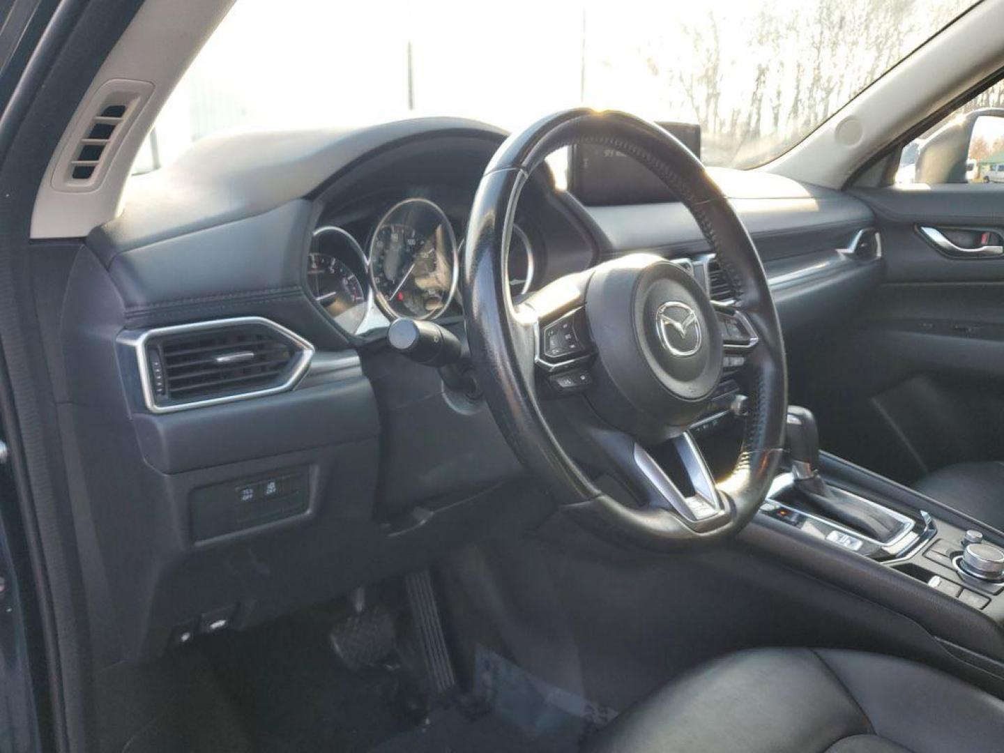 2021 Deep Crystal Blue Mica /Black Mazda CX-5 Touring (JM3KFACM6M0) with an 2.5L L4 DOHC 16V engine, 6A transmission, located at 234 Columbia Ave, Battle Creek, MI, 49015, (269) 222-0088, 42.298264, -85.192543 - <b>Vehicle Details</b><br>Experience the perfect blend of style, performance, and comfort with this pristine 2021 Mazda CX-5 Touring! With an impressive 0 miles on the odometer, this vehicle is practically brand new and ready to hit the road with you. The sleek design and dynamic curves of the Mazda - Photo#12