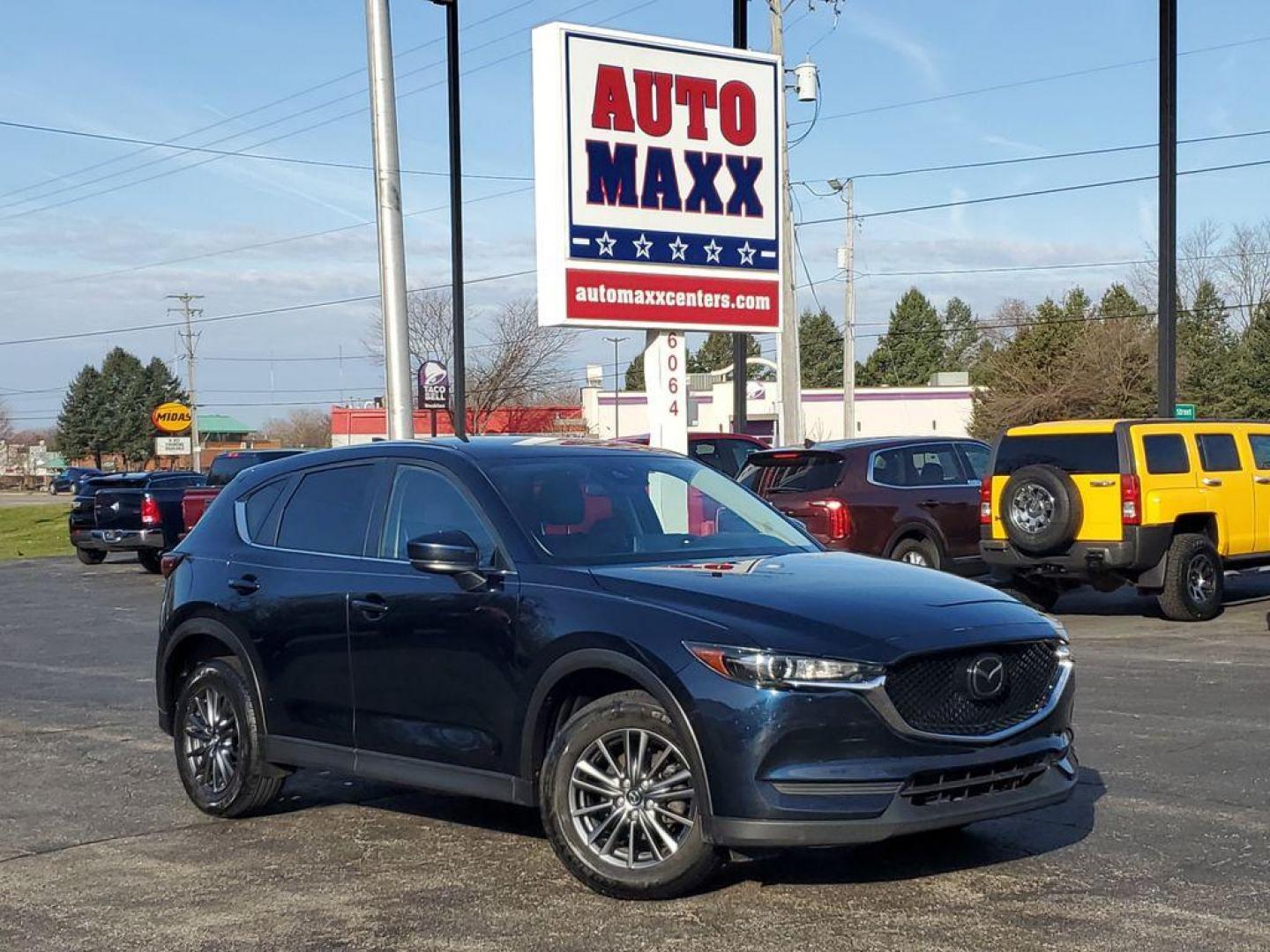 2021 Deep Crystal Blue Mica /Black Mazda CX-5 Touring (JM3KFACM6M0) with an 2.5L L4 DOHC 16V engine, 6A transmission, located at 234 Columbia Ave, Battle Creek, MI, 49015, (269) 222-0088, 42.298264, -85.192543 - <b>Vehicle Details</b><br>Experience the perfect blend of style, performance, and comfort with this pristine 2021 Mazda CX-5 Touring! With an impressive 0 miles on the odometer, this vehicle is practically brand new and ready to hit the road with you. The sleek design and dynamic curves of the Mazda - Photo#0