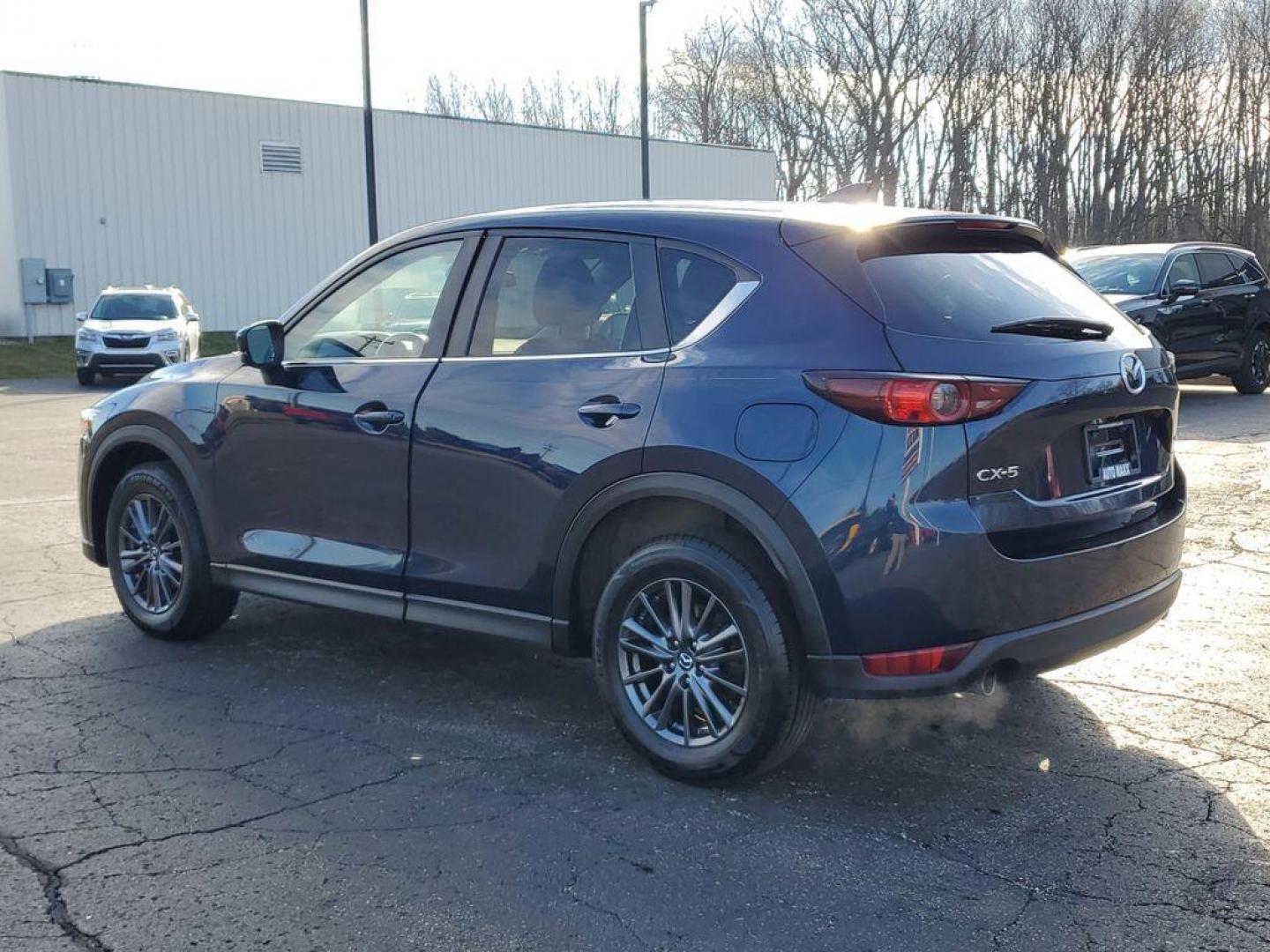 2021 Deep Crystal Blue Mica /Black Mazda CX-5 Touring (JM3KFACM6M0) with an 2.5L L4 DOHC 16V engine, 6A transmission, located at 234 Columbia Ave, Battle Creek, MI, 49015, (269) 222-0088, 42.298264, -85.192543 - <b>Vehicle Details</b><br>Experience the perfect blend of style, performance, and comfort with this pristine 2021 Mazda CX-5 Touring! With an impressive 0 miles on the odometer, this vehicle is practically brand new and ready to hit the road with you. The sleek design and dynamic curves of the Mazda - Photo#2