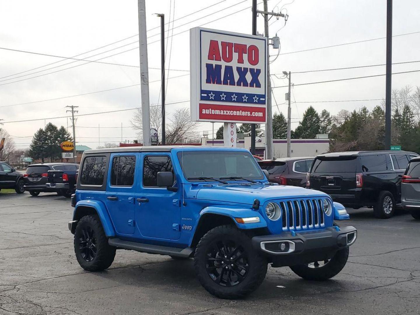 2022 Hydro Blue Pearlcoat /Black Jeep Wrangler Unlimited Sahara 4XE (1C4JJXP69NW) with an 2.0L L4 DOHC 16V HYBRID engine, 8A transmission, located at 6064 Gull Rd, Kalamazoo, MI, 49048, (269) 222-0088, 42.328388, -85.512924 - <b>Summary</b><br>Technology Group<br><br><b>Vehicle Details</b><br>Introducing the 2022 Jeep Wrangler Unlimited Sahara, a pristine example of rugged sophistication with zero miles on the odometer. This vehicle seamlessly blends legendary off-road capability with modern comfort, making it an ideal c - Photo#0