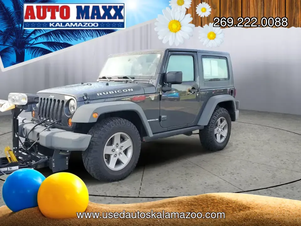 2010 Gray /Dark Khaki/Medium Khaki Jeep Wrangler Rubicon (1J4BA6D15AL) with an V6, 3.8L engine, 4-speed automatic transmission, located at 6064 Gull Rd, Kalamazoo, MI, 49048, (269) 222-0088, 42.328388, -85.512924 - Adventure awaits with our remarkable 2010 Jeep Wrangler Rubicon 4WD, a vehicle that embodies freedom and exploration. Whether you're looking to tackle rugged terrains on weekend getaways or navigate the urban jungle with style, this SUV is your perfect companion. With its iconic design and robust fe - Photo#1