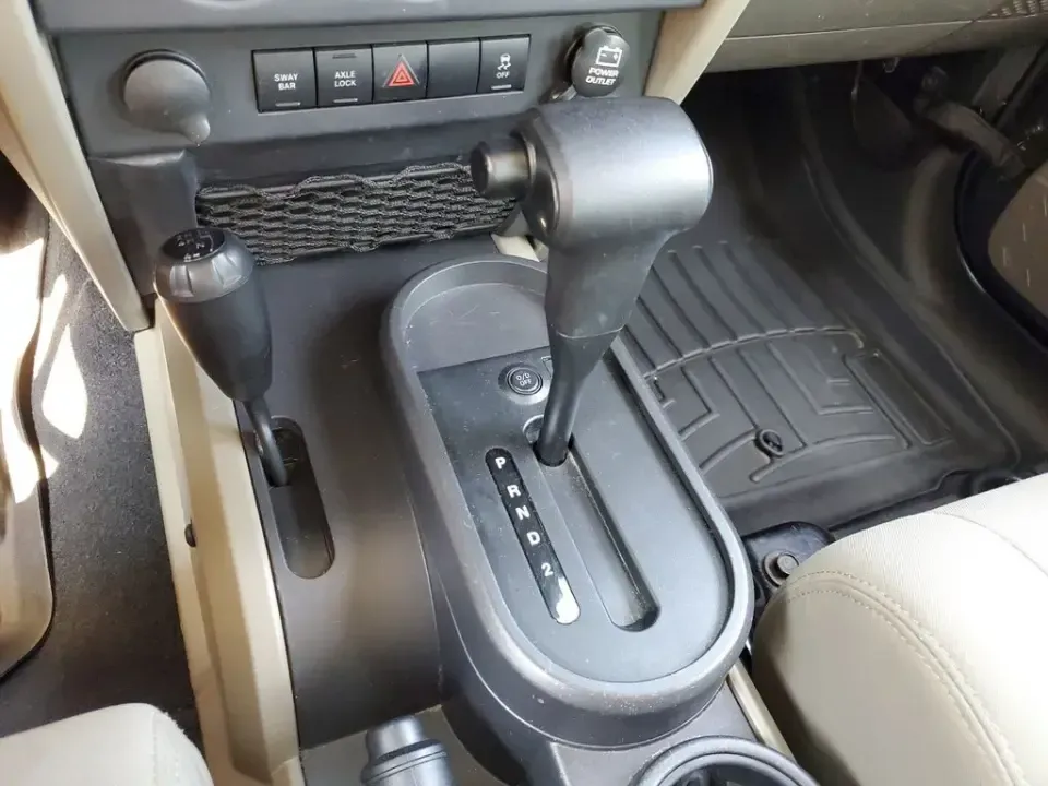 2010 Gray /Dark Khaki/Medium Khaki Jeep Wrangler Rubicon (1J4BA6D15AL) with an V6, 3.8L engine, 4-speed automatic transmission, located at 6064 Gull Rd, Kalamazoo, MI, 49048, (269) 222-0088, 42.328388, -85.512924 - Adventure awaits with our remarkable 2010 Jeep Wrangler Rubicon 4WD, a vehicle that embodies freedom and exploration. Whether you're looking to tackle rugged terrains on weekend getaways or navigate the urban jungle with style, this SUV is your perfect companion. With its iconic design and robust fe - Photo#19