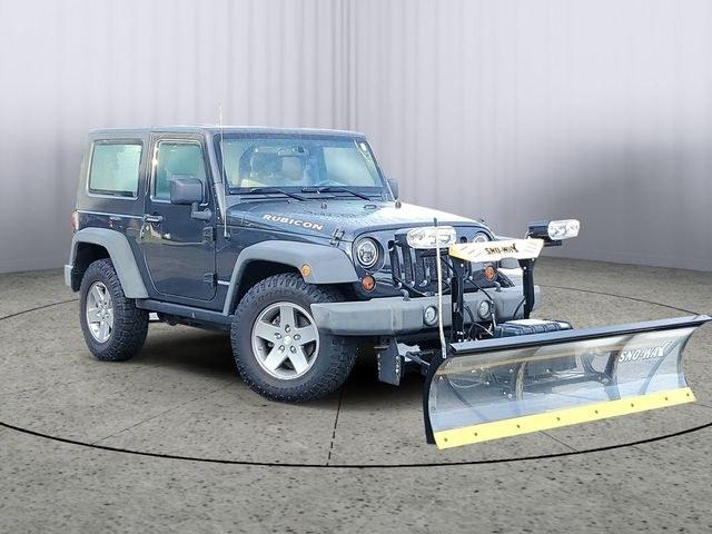 2010 Dark Charcoal /Dark Khaki/Medium Khaki Jeep Wrangler Rubicon (1J4BA6D15AL) with an 3.8L V6 SMPI engine, Automatic transmission, located at 6064 Gull Rd, Kalamazoo, MI, 49048, (269) 222-0088, 42.328388, -85.512924- Photo#0