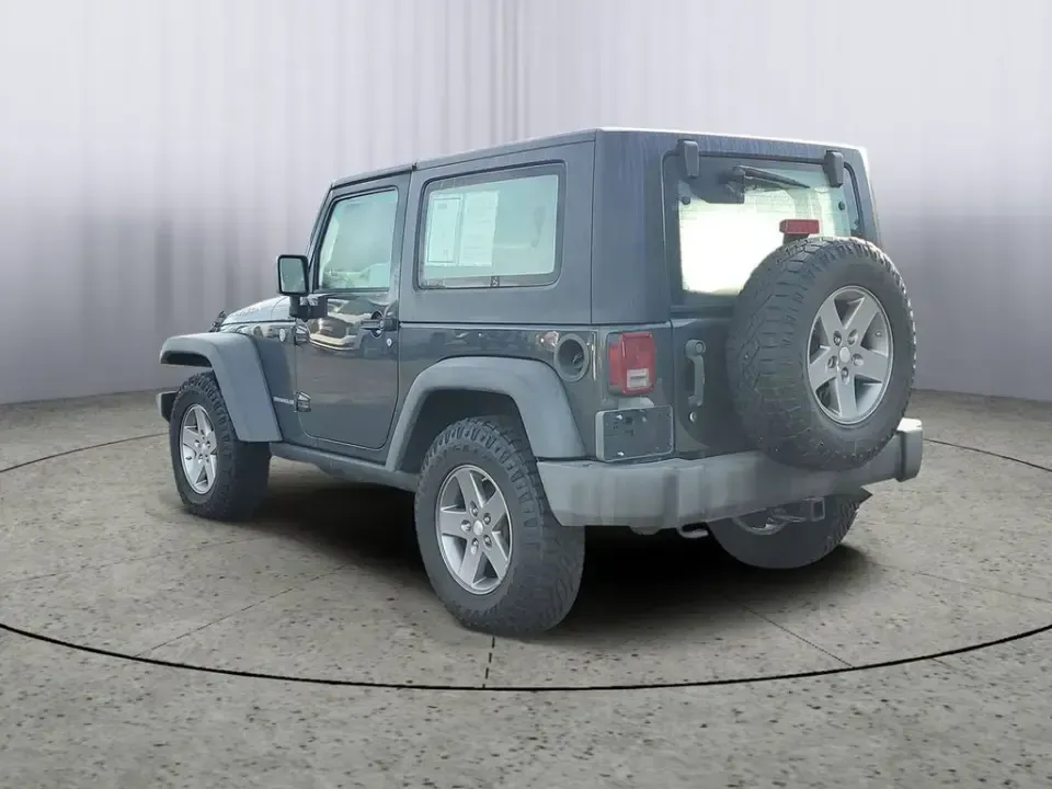 2010 Gray /Dark Khaki/Medium Khaki Jeep Wrangler Rubicon (1J4BA6D15AL) with an V6, 3.8L engine, 4-speed automatic transmission, located at 6064 Gull Rd, Kalamazoo, MI, 49048, (269) 222-0088, 42.328388, -85.512924 - Adventure awaits with our remarkable 2010 Jeep Wrangler Rubicon 4WD, a vehicle that embodies freedom and exploration. Whether you're looking to tackle rugged terrains on weekend getaways or navigate the urban jungle with style, this SUV is your perfect companion. With its iconic design and robust fe - Photo#2