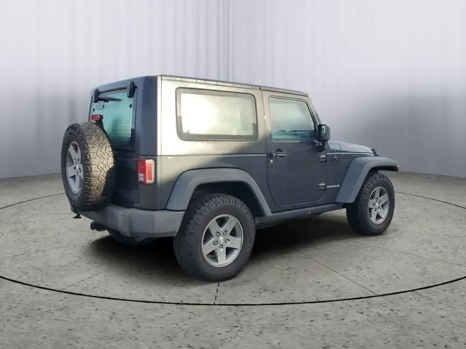 2010 Gray /Dark Khaki/Medium Khaki Jeep Wrangler Rubicon (1J4BA6D15AL) with an V6, 3.8L engine, 4-speed automatic transmission, located at 6064 Gull Rd, Kalamazoo, MI, 49048, (269) 222-0088, 42.328388, -85.512924 - Adventure awaits with our remarkable 2010 Jeep Wrangler Rubicon 4WD, a vehicle that embodies freedom and exploration. Whether you're looking to tackle rugged terrains on weekend getaways or navigate the urban jungle with style, this SUV is your perfect companion. With its iconic design and robust fe - Photo#3