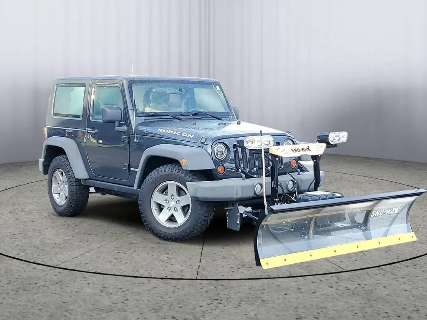 2010 Gray /Dark Khaki/Medium Khaki Jeep Wrangler Rubicon (1J4BA6D15AL) with an V6, 3.8L engine, 4-speed automatic transmission, located at 6064 Gull Rd, Kalamazoo, MI, 49048, (269) 222-0088, 42.328388, -85.512924 - Adventure awaits with our remarkable 2010 Jeep Wrangler Rubicon 4WD, a vehicle that embodies freedom and exploration. Whether you're looking to tackle rugged terrains on weekend getaways or navigate the urban jungle with style, this SUV is your perfect companion. With its iconic design and robust fe - Photo#1
