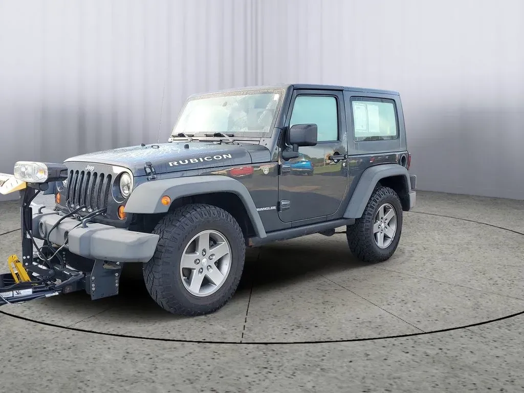 2010 Gray /Dark Khaki/Medium Khaki Jeep Wrangler Rubicon (1J4BA6D15AL) with an V6, 3.8L engine, 4-speed automatic transmission, located at 6064 Gull Rd, Kalamazoo, MI, 49048, (269) 222-0088, 42.328388, -85.512924 - Adventure awaits with our remarkable 2010 Jeep Wrangler Rubicon 4WD, a vehicle that embodies freedom and exploration. Whether you're looking to tackle rugged terrains on weekend getaways or navigate the urban jungle with style, this SUV is your perfect companion. With its iconic design and robust fe - Photo#2