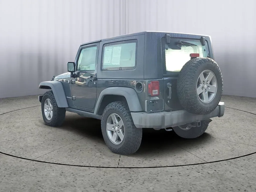 2010 Gray /Dark Khaki/Medium Khaki Jeep Wrangler Rubicon (1J4BA6D15AL) with an V6, 3.8L engine, 4-speed automatic transmission, located at 6064 Gull Rd, Kalamazoo, MI, 49048, (269) 222-0088, 42.328388, -85.512924 - Adventure awaits with our remarkable 2010 Jeep Wrangler Rubicon 4WD, a vehicle that embodies freedom and exploration. Whether you're looking to tackle rugged terrains on weekend getaways or navigate the urban jungle with style, this SUV is your perfect companion. With its iconic design and robust fe - Photo#3