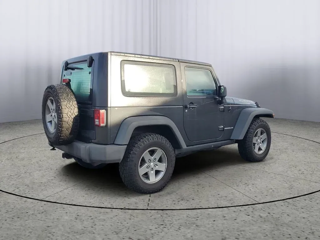 2010 Gray /Dark Khaki/Medium Khaki Jeep Wrangler Rubicon (1J4BA6D15AL) with an V6, 3.8L engine, 4-speed automatic transmission, located at 6064 Gull Rd, Kalamazoo, MI, 49048, (269) 222-0088, 42.328388, -85.512924 - Adventure awaits with our remarkable 2010 Jeep Wrangler Rubicon 4WD, a vehicle that embodies freedom and exploration. Whether you're looking to tackle rugged terrains on weekend getaways or navigate the urban jungle with style, this SUV is your perfect companion. With its iconic design and robust fe - Photo#4