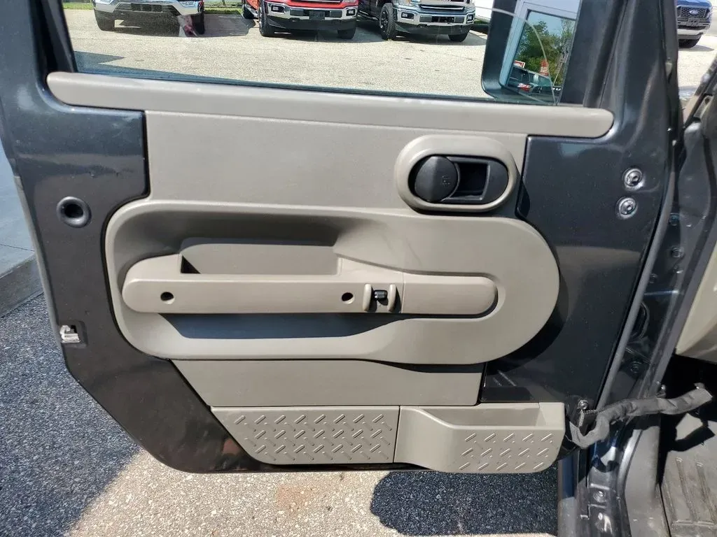 2010 Gray /Dark Khaki/Medium Khaki Jeep Wrangler Rubicon (1J4BA6D15AL) with an V6, 3.8L engine, 4-speed automatic transmission, located at 6064 Gull Rd, Kalamazoo, MI, 49048, (269) 222-0088, 42.328388, -85.512924 - Adventure awaits with our remarkable 2010 Jeep Wrangler Rubicon 4WD, a vehicle that embodies freedom and exploration. Whether you're looking to tackle rugged terrains on weekend getaways or navigate the urban jungle with style, this SUV is your perfect companion. With its iconic design and robust fe - Photo#9