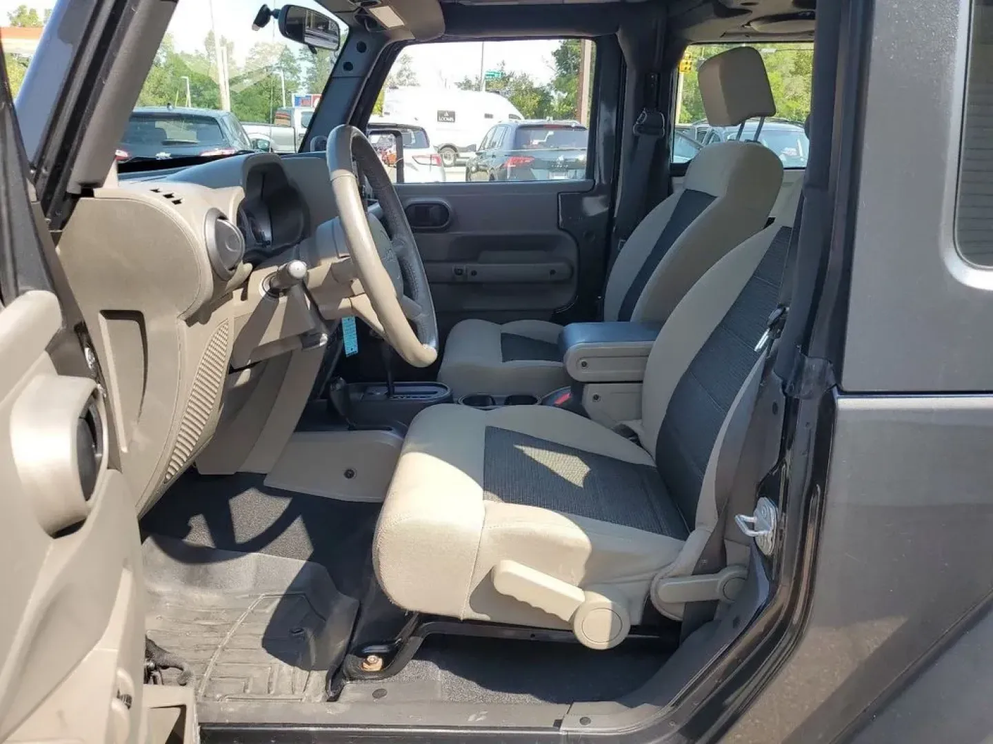 2010 Gray /Dark Khaki/Medium Khaki Jeep Wrangler Rubicon (1J4BA6D15AL) with an V6, 3.8L engine, 4-speed automatic transmission, located at 6064 Gull Rd, Kalamazoo, MI, 49048, (269) 222-0088, 42.328388, -85.512924 - Adventure awaits with our remarkable 2010 Jeep Wrangler Rubicon 4WD, a vehicle that embodies freedom and exploration. Whether you're looking to tackle rugged terrains on weekend getaways or navigate the urban jungle with style, this SUV is your perfect companion. With its iconic design and robust fe - Photo#10