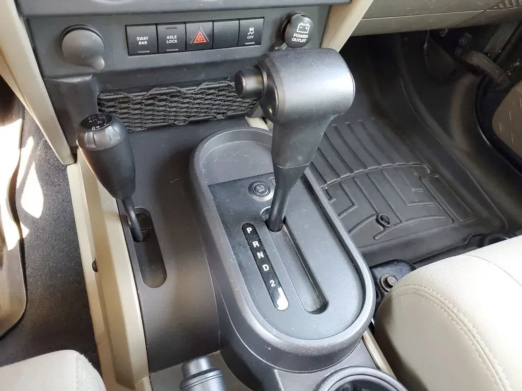 2010 Gray /Dark Khaki/Medium Khaki Jeep Wrangler Rubicon (1J4BA6D15AL) with an V6, 3.8L engine, 4-speed automatic transmission, located at 6064 Gull Rd, Kalamazoo, MI, 49048, (269) 222-0088, 42.328388, -85.512924 - Adventure awaits with our remarkable 2010 Jeep Wrangler Rubicon 4WD, a vehicle that embodies freedom and exploration. Whether you're looking to tackle rugged terrains on weekend getaways or navigate the urban jungle with style, this SUV is your perfect companion. With its iconic design and robust fe - Photo#20