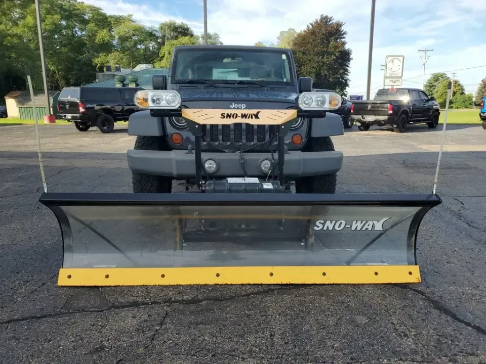 2010 Gray /Dark Khaki/Medium Khaki Jeep Wrangler Rubicon (1J4BA6D15AL) with an V6, 3.8L engine, 4-speed automatic transmission, located at 6064 Gull Rd, Kalamazoo, MI, 49048, (269) 222-0088, 42.328388, -85.512924 - Adventure awaits with our remarkable 2010 Jeep Wrangler Rubicon 4WD, a vehicle that embodies freedom and exploration. Whether you're looking to tackle rugged terrains on weekend getaways or navigate the urban jungle with style, this SUV is your perfect companion. With its iconic design and robust fe - Photo#4