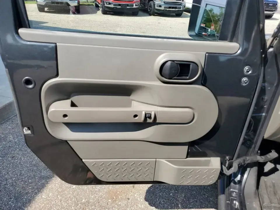 2010 Gray /Dark Khaki/Medium Khaki Jeep Wrangler Rubicon (1J4BA6D15AL) with an V6, 3.8L engine, 4-speed automatic transmission, located at 6064 Gull Rd, Kalamazoo, MI, 49048, (269) 222-0088, 42.328388, -85.512924 - Adventure awaits with our remarkable 2010 Jeep Wrangler Rubicon 4WD, a vehicle that embodies freedom and exploration. Whether you're looking to tackle rugged terrains on weekend getaways or navigate the urban jungle with style, this SUV is your perfect companion. With its iconic design and robust fe - Photo#8