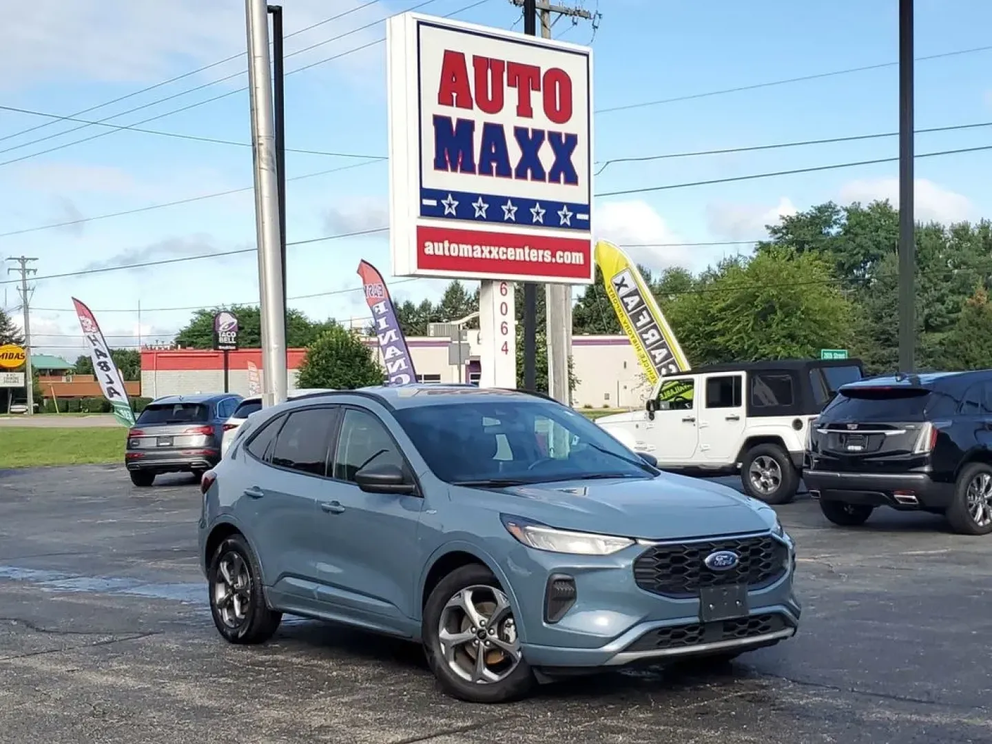 2023 Vapor Blue Metallic /Ebony Ford Escape ST-Line (1FMCU0MN4PU) with an 3 Cyl, 1.5L engine, 8-speed automatic transmission, located at 6064 Gull Rd, Kalamazoo, MI, 49048, (269) 222-0088, 42.328388, -85.512924 - Discover the exceptional performance and sleek design of the 2023 Ford Escape ST Line. This pre-owned model, now available at our dealership, offers an impressive combination of style, efficiency, and advanced technology. Powered by a fuel-efficient 3-cylinder, 1.5L engine, this Front Wheel Drive (F - Photo#1
