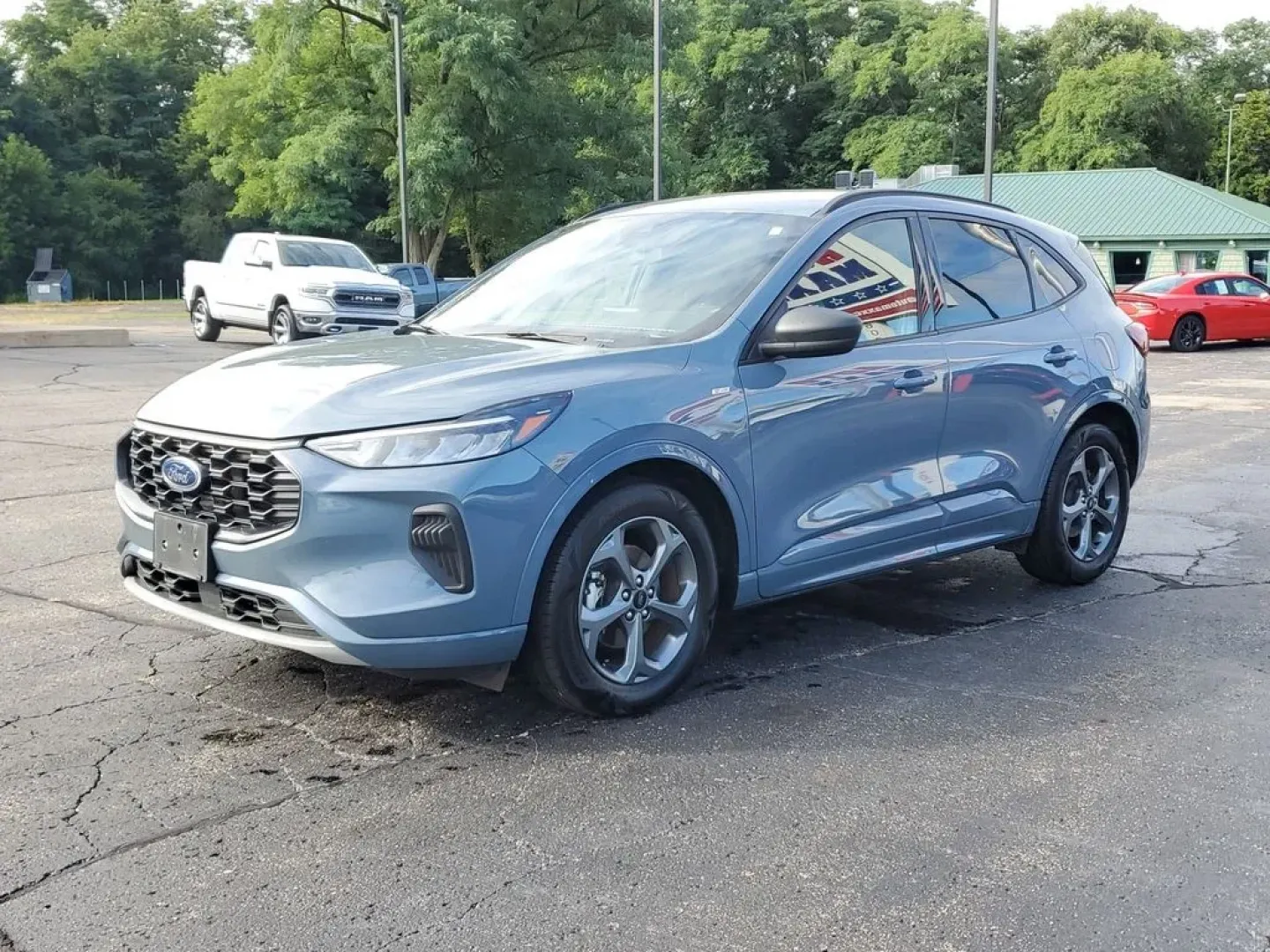 2023 Vapor Blue Metallic /Ebony Ford Escape ST-Line (1FMCU0MN4PU) with an 3 Cyl, 1.5L engine, 8-speed automatic transmission, located at 6064 Gull Rd, Kalamazoo, MI, 49048, (269) 222-0088, 42.328388, -85.512924 - Discover the exceptional performance and sleek design of the 2023 Ford Escape ST Line. This pre-owned model, now available at our dealership, offers an impressive combination of style, efficiency, and advanced technology. Powered by a fuel-efficient 3-cylinder, 1.5L engine, this Front Wheel Drive (F - Photo#2