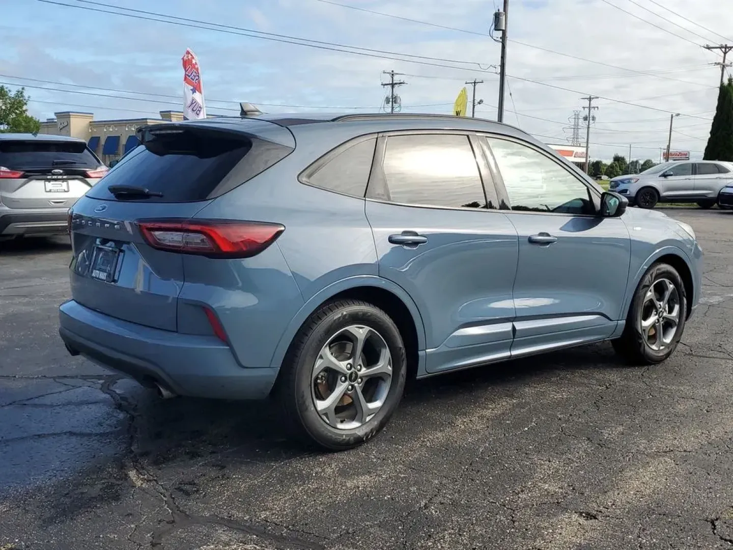 2023 Vapor Blue Metallic /Ebony Ford Escape ST-Line (1FMCU0MN4PU) with an 3 Cyl, 1.5L engine, 8-speed automatic transmission, located at 6064 Gull Rd, Kalamazoo, MI, 49048, (269) 222-0088, 42.328388, -85.512924 - Discover the exceptional performance and sleek design of the 2023 Ford Escape ST Line. This pre-owned model, now available at our dealership, offers an impressive combination of style, efficiency, and advanced technology. Powered by a fuel-efficient 3-cylinder, 1.5L engine, this Front Wheel Drive (F - Photo#4