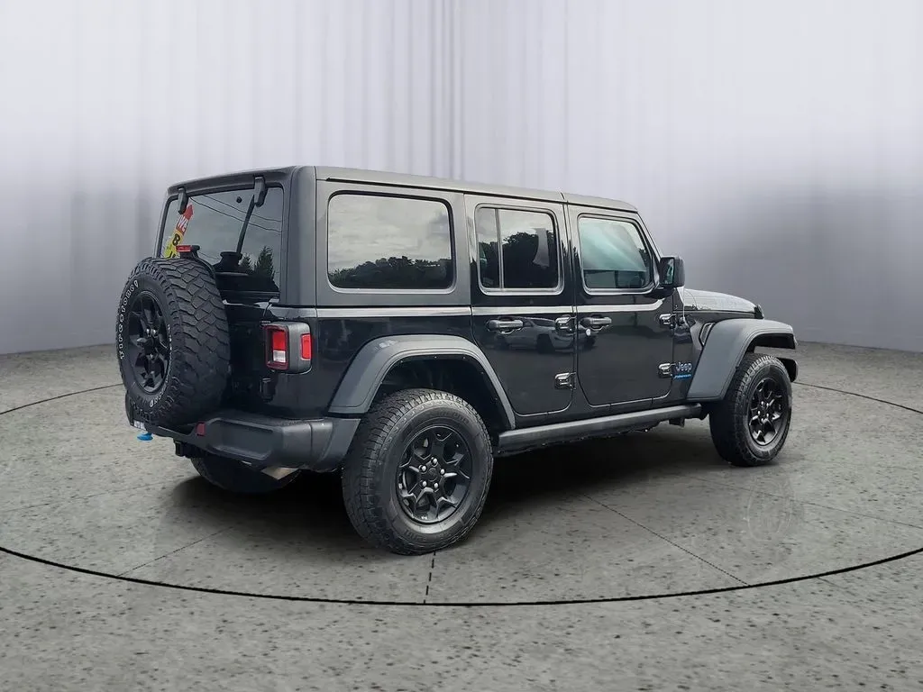2023 BLACK /Black Jeep Wrangler Willys 4xe (1C4JJXN68PW) with an 4 Cyl, 2.0L engine, Automatic transmission, located at 6064 Gull Rd, Kalamazoo, MI, 49048, (269) 222-0088, 42.328388, -85.512924 - **Unleash Your Adventurous Spirit with the 2023 Jeep Wrangler Unlimited High Altitude 4XE!**<br /> <br /> Are you ready to take your weekend adventures to the next level? Look no further than this stunning 2023 Jeep Wrangler Unlimited High Altitude 4XE, now available at AutoMaxx Kalamazoo. With its - Photo#4