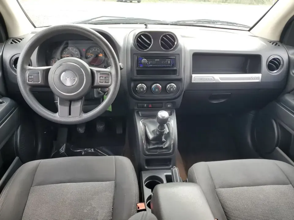 2015 /Dark Slate Gray Jeep Compass Sport (1C4NJDBB8FD) with an 4 Cyl, 2.4L engine, 5-speed manual transmission, located at 6064 Gull Rd, Kalamazoo, MI, 49048, (269) 222-0088, 42.328388, -85.512924 - Weekend trailheads, snowy commutes, and spontaneous road trips up to Lake Michigan all get easier when you've got a compact SUV that's ready for real life. This **2015 Jeep Compass Sport 4WD** is built for drivers who want everyday practicality with the confidence to handle Michigan weather-whether - Photo#8