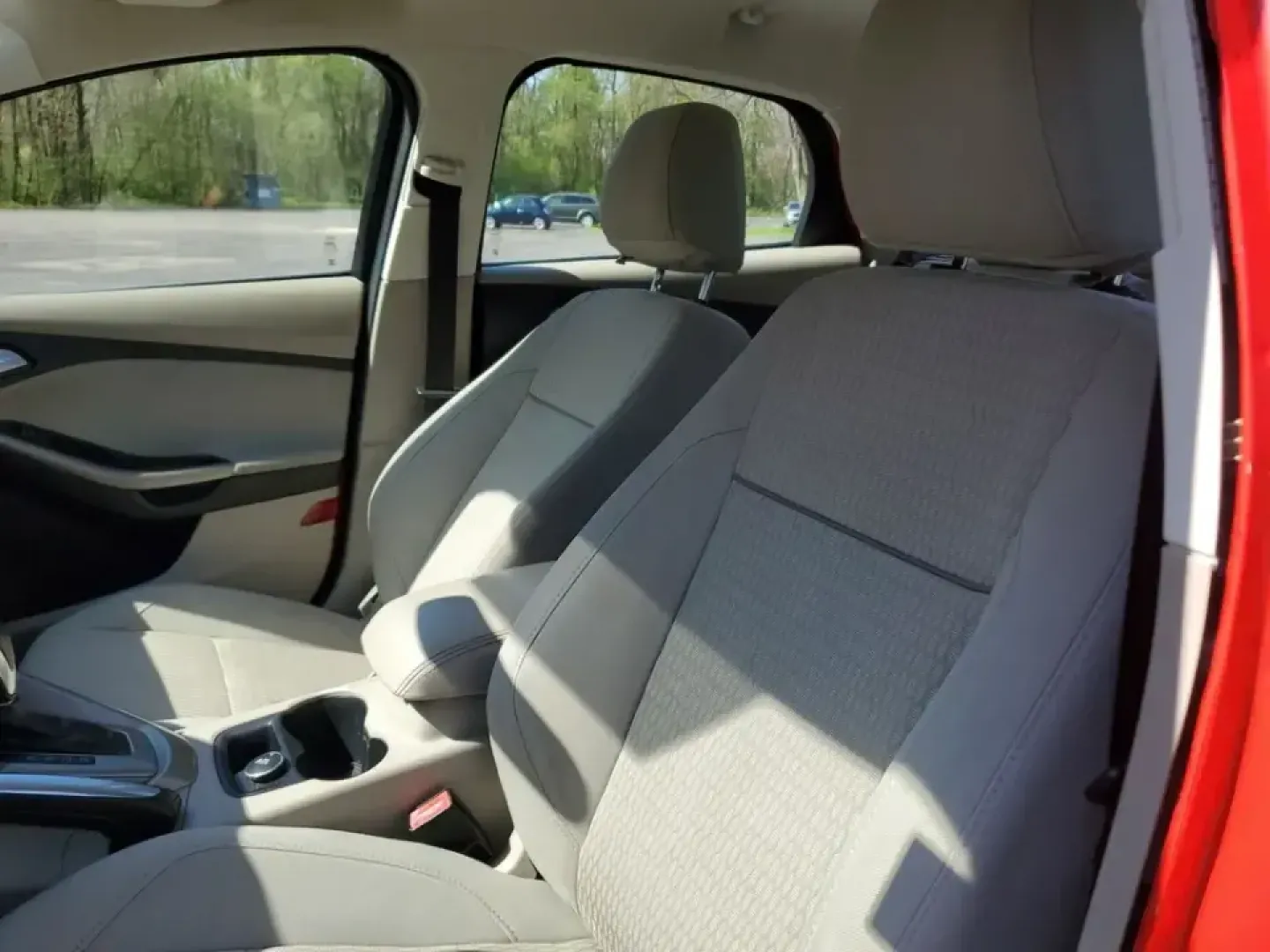 2012 /Medium Light Stone Ford Focus SEL (1FAHP3H24CL) with an 4 Cyl, 2.0L engine, 6-speed auto-shift manual transmission, located at 6064 Gull Rd, Kalamazoo, MI, 49048, (269) 222-0088, 42.328388, -85.512924 - Need a dependable commuter that keeps fuel stops and stress low while you cruise from Gull Road to Downtown Kalamazoo, campus, or the weekend farmers market? This Race Red 2012 Ford Focus SEL sedan is a smart pick for daily driving, first-time buyers, and budget-conscious shoppers who want a practic - Photo#12