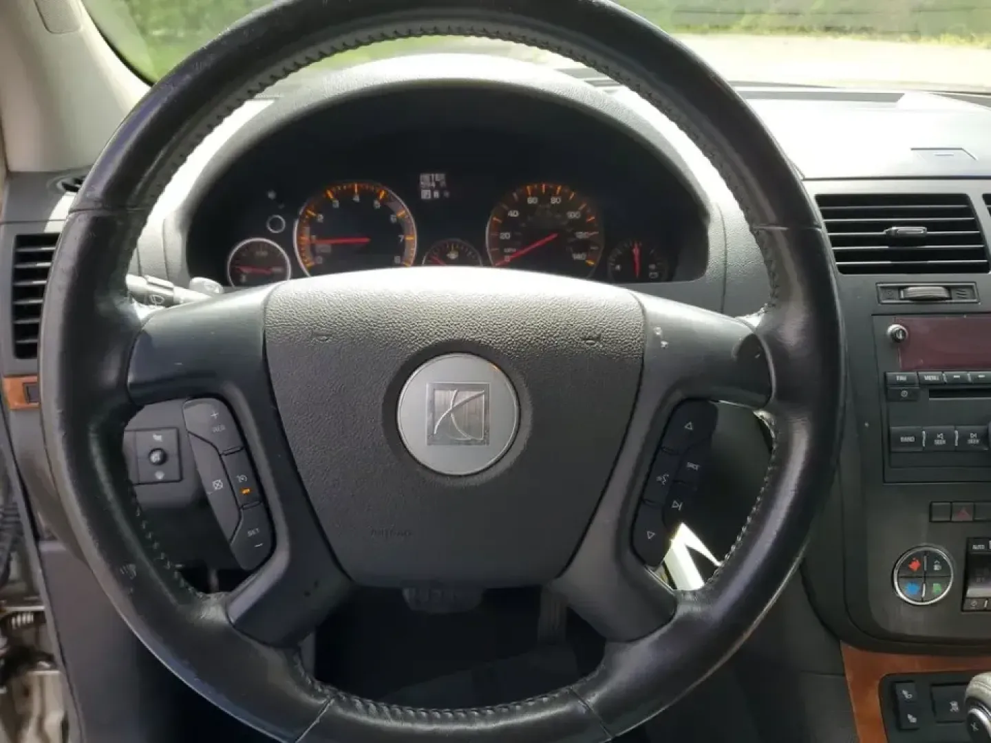 2007 /Black Saturn Outlook XR (5GZER23787J) with an V6, 3.6L engine, 6-speed automatic transmission, located at 6064 Gull Rd, Kalamazoo, MI, 49048, (269) 222-0088, 42.328388, -85.512924 - Need a spacious SUV that can handle school drop-offs, long commutes down I-94, and weekend getaways to Lake Michigan without feeling cramped? This 2007 Saturn Outlook XR is built for real-life Michigan driving-room for the whole crew, smart comfort features, and the kind of everyday versatility that - Photo#16