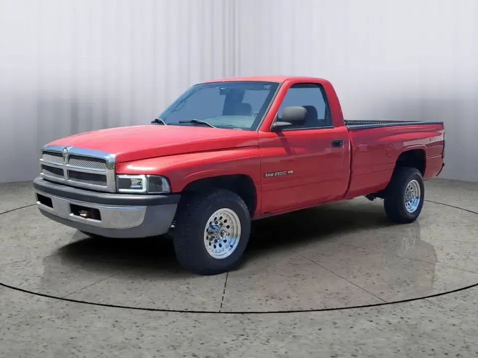 2002 Dodge Ram Pickup ST (3B7KC26Z32M) with an V8, 5.9L engine, 5-speed manual transmission, located at 6064 Gull Rd, Kalamazoo, MI, 49048, (269) 222-0088, 42.328388, -85.512924 - Need a dependable workhorse for job sites, weekend projects, or hauling gear up and down I-94? This red 2002 Dodge Ram Pickup ST is the kind of no-nonsense truck that fits real life in Kalamazoo-whether you're commuting across town, making supply runs to Gull Road hardware stores, or heading out tow - Photo#1