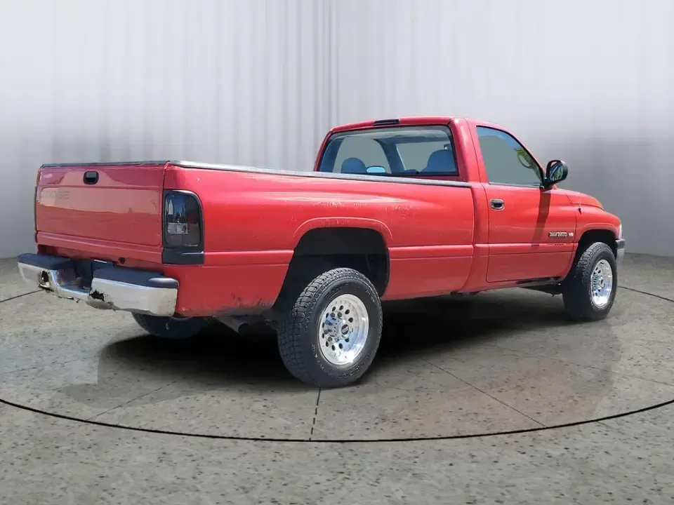 2002 Dodge Ram Pickup ST (3B7KC26Z32M) with an V8, 5.9L engine, 5-speed manual transmission, located at 6064 Gull Rd, Kalamazoo, MI, 49048, (269) 222-0088, 42.328388, -85.512924 - Need a dependable workhorse for job sites, weekend projects, or hauling gear up and down I-94? This red 2002 Dodge Ram Pickup ST is the kind of no-nonsense truck that fits real life in Kalamazoo-whether you're commuting across town, making supply runs to Gull Road hardware stores, or heading out tow - Photo#3