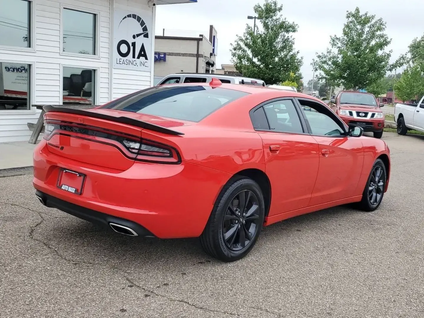 2020 Torred Clearcoat /Black Dodge Charger SXT (2C3CDXJG7LH) with an V6, 3.6L engine, 8-speed automatic transmission, located at 6064 Gull Rd, Kalamazoo, MI, 49048, (269) 222-0088, 42.328388, -85.512924 - <b>Summary</b><br>Aftermarket sport exhaust<br><br><b>Vehicle Details</b><br>Aftermarket sport exhaust. Looking for a dynamic blend of performance and comfort? Check out this 2020 Dodge Charger SXT, equipped with All-Wheel Drive and a powerful V6, 3.6L engine. This standout sedan balances thrilling - Photo#1